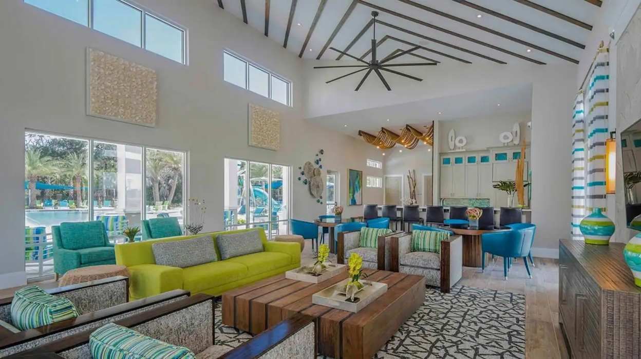 Stylish clubhouse with modern decor, cozy seating, and poolside views for relaxation