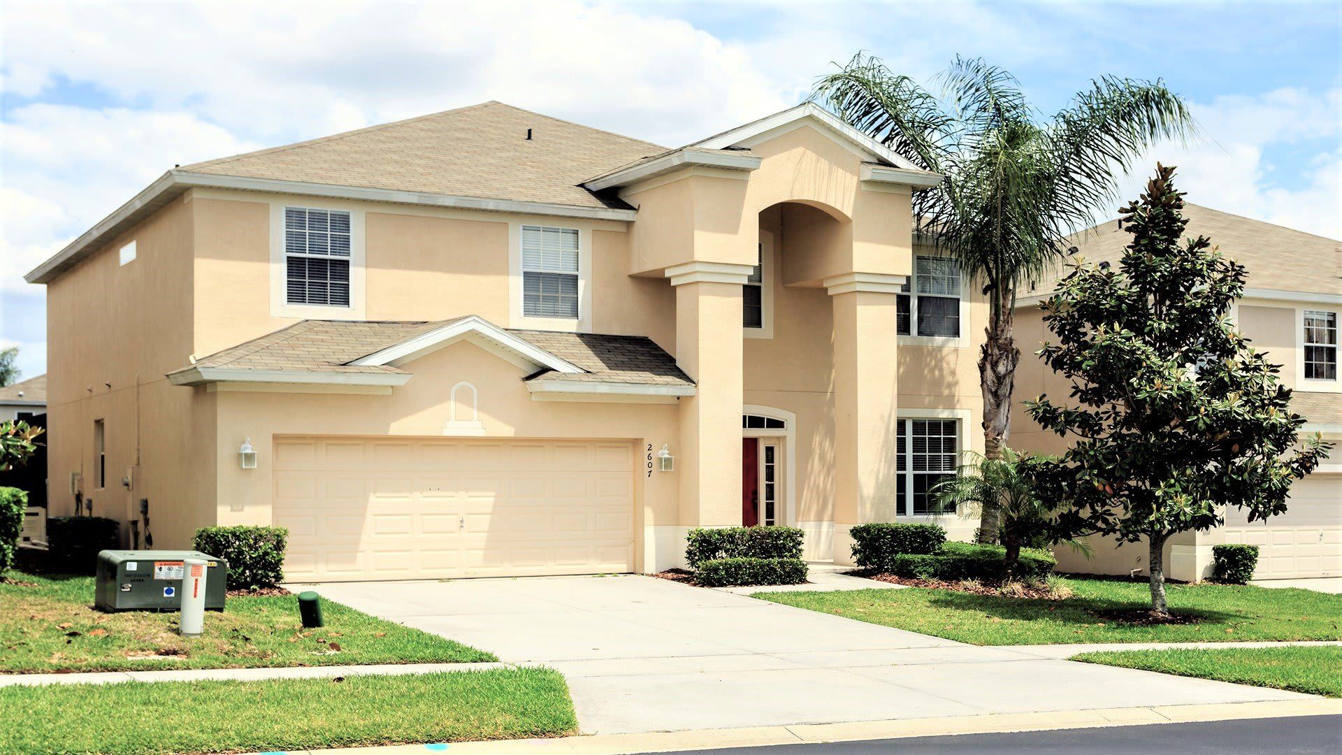 Spacious 2-story villa with a grand entry, lush landscaping, and a 2-car garage!