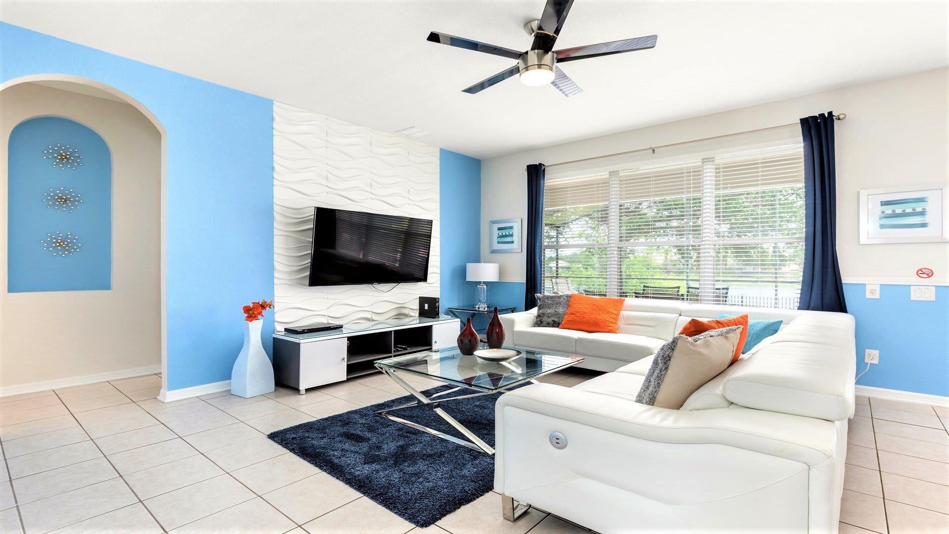 Modern, stylish living space with bright decor, lake views, and cozy seating.