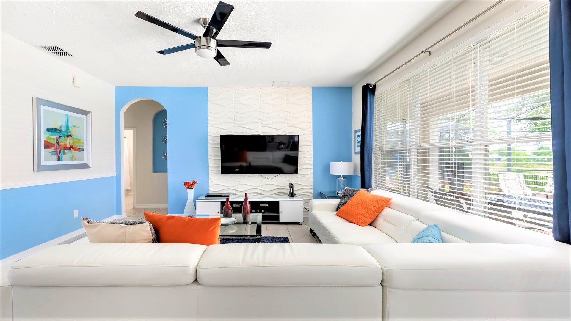 Stylish living space with modern decor, bright accents, and lakeview access.