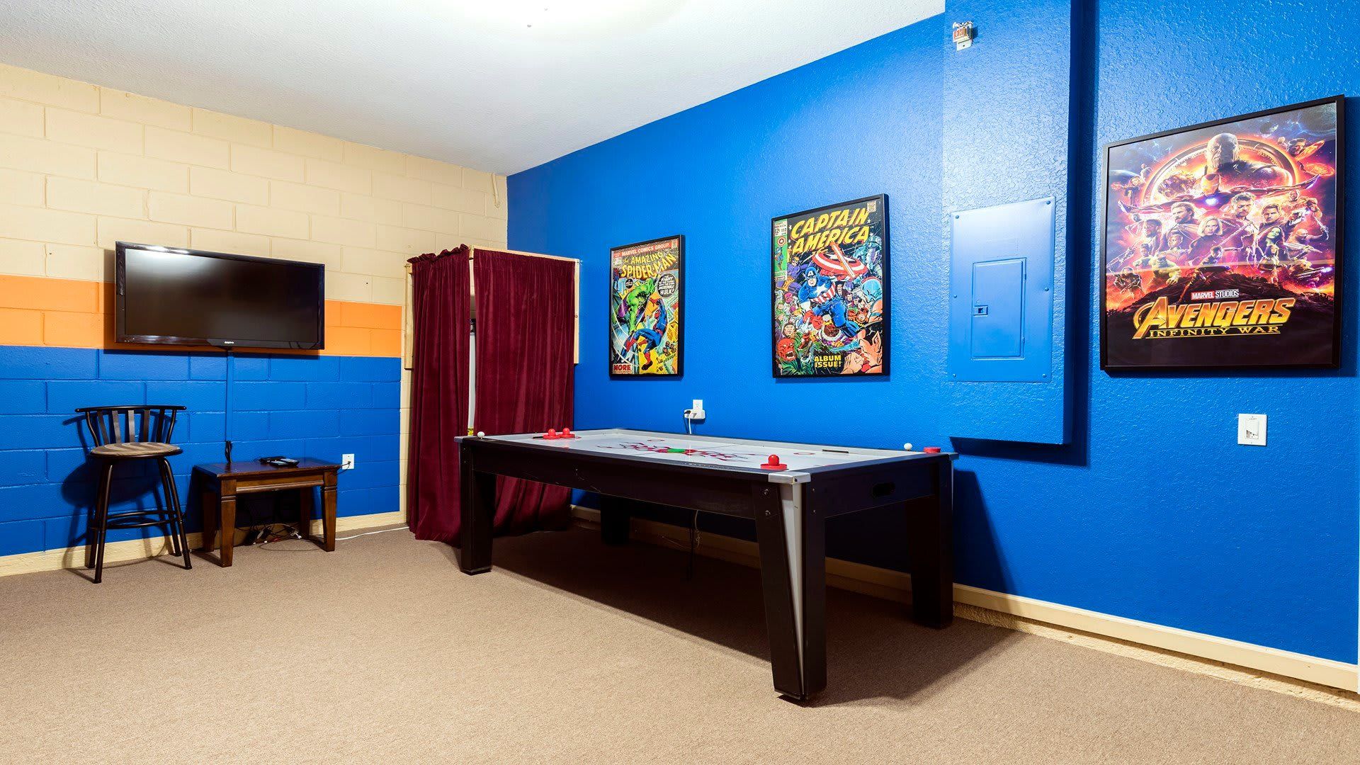 The game room is stylishly furnished with Avengers theme