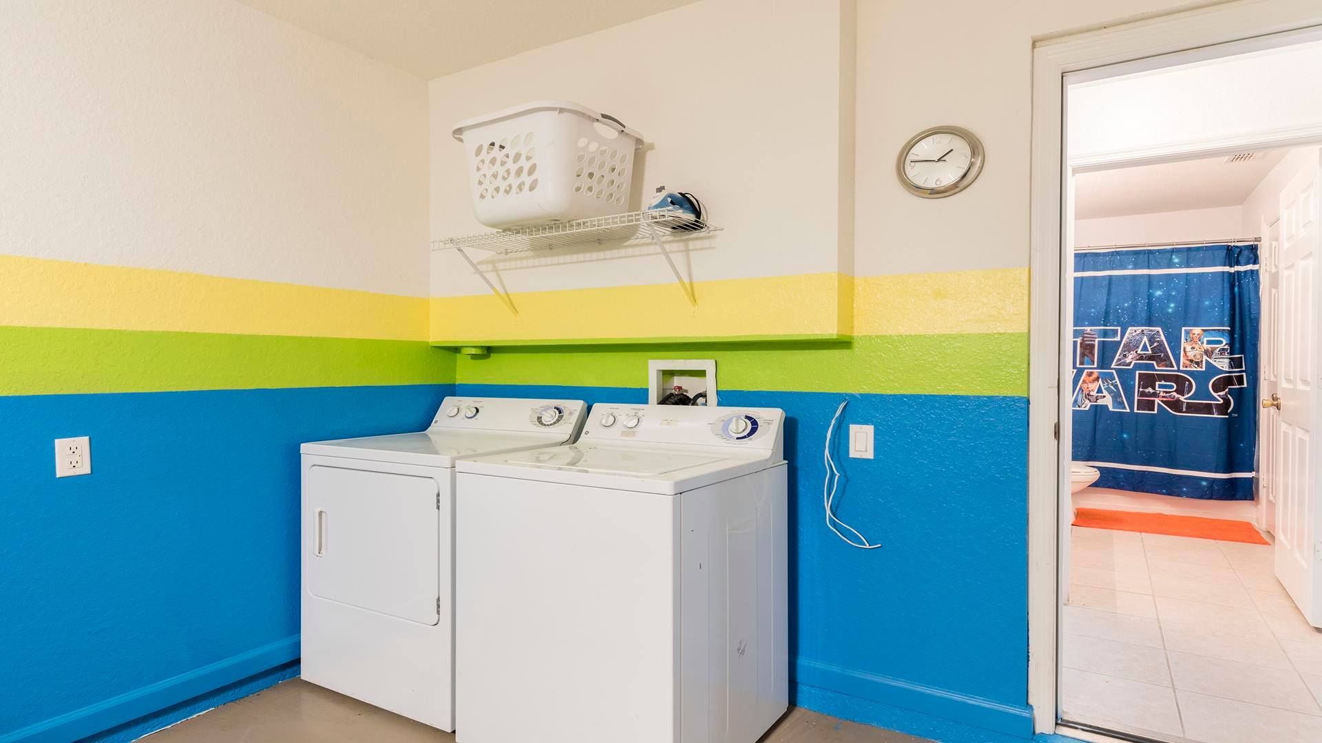 Vibrant laundry room with washer, dryer, and fun colorful decor for a cheerful touch.