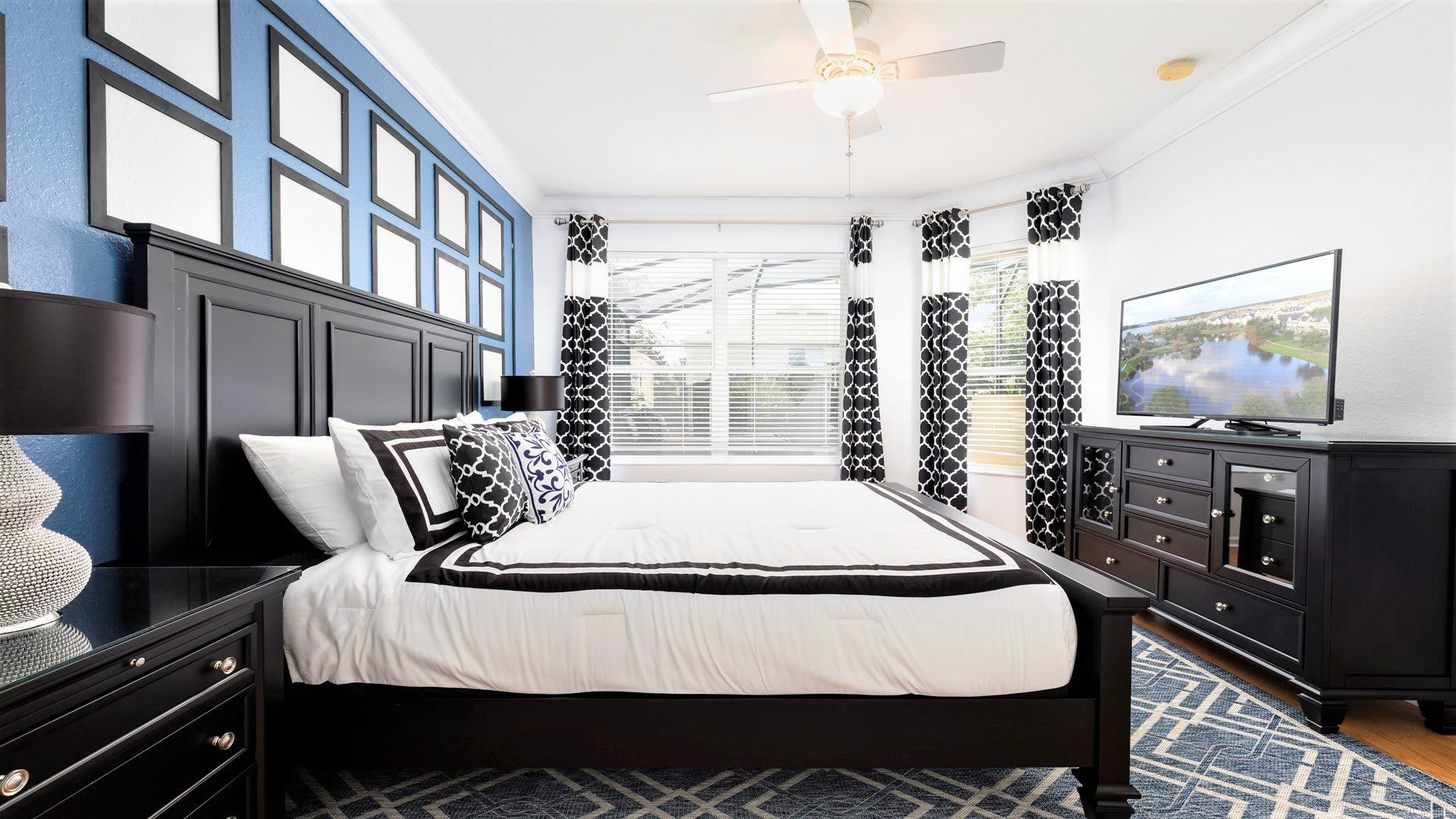 The master bedroom on the ground floor with a luxuriously large king bed