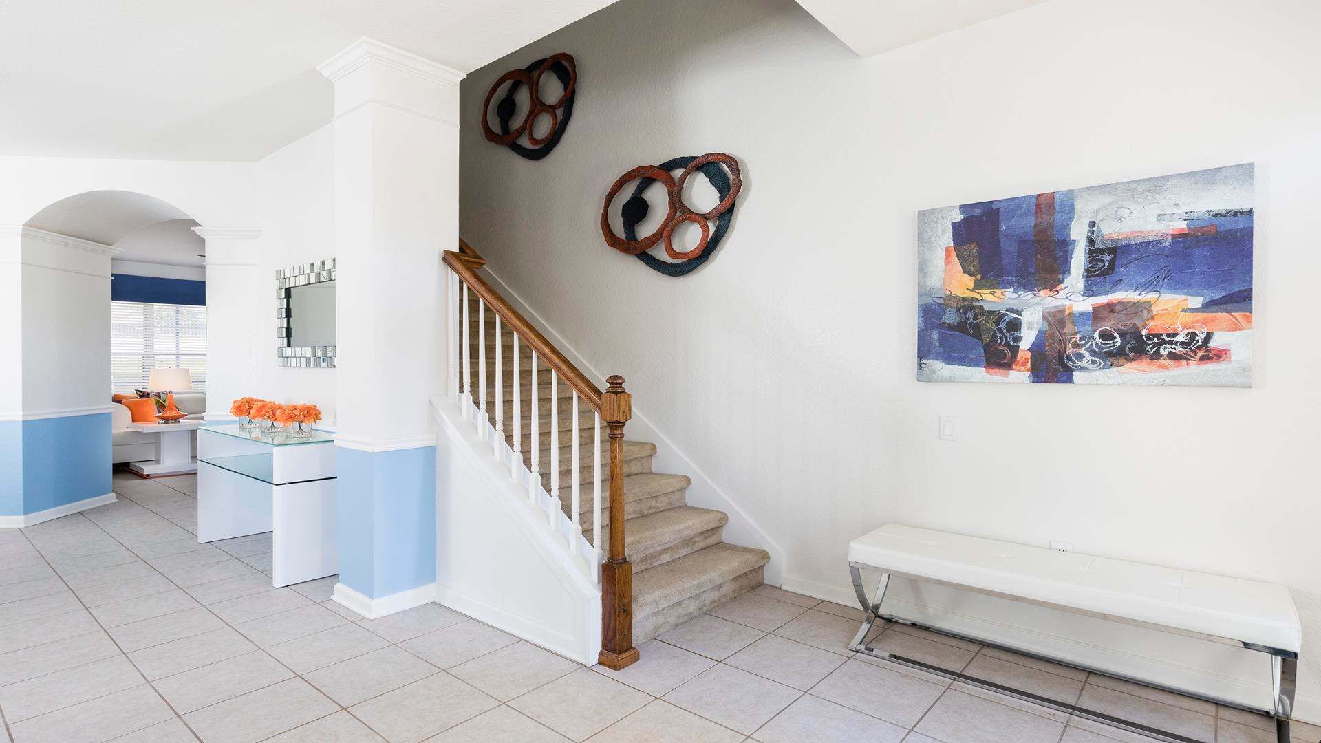 Bright and modern entryway with stylish décor and an inviting open layout.