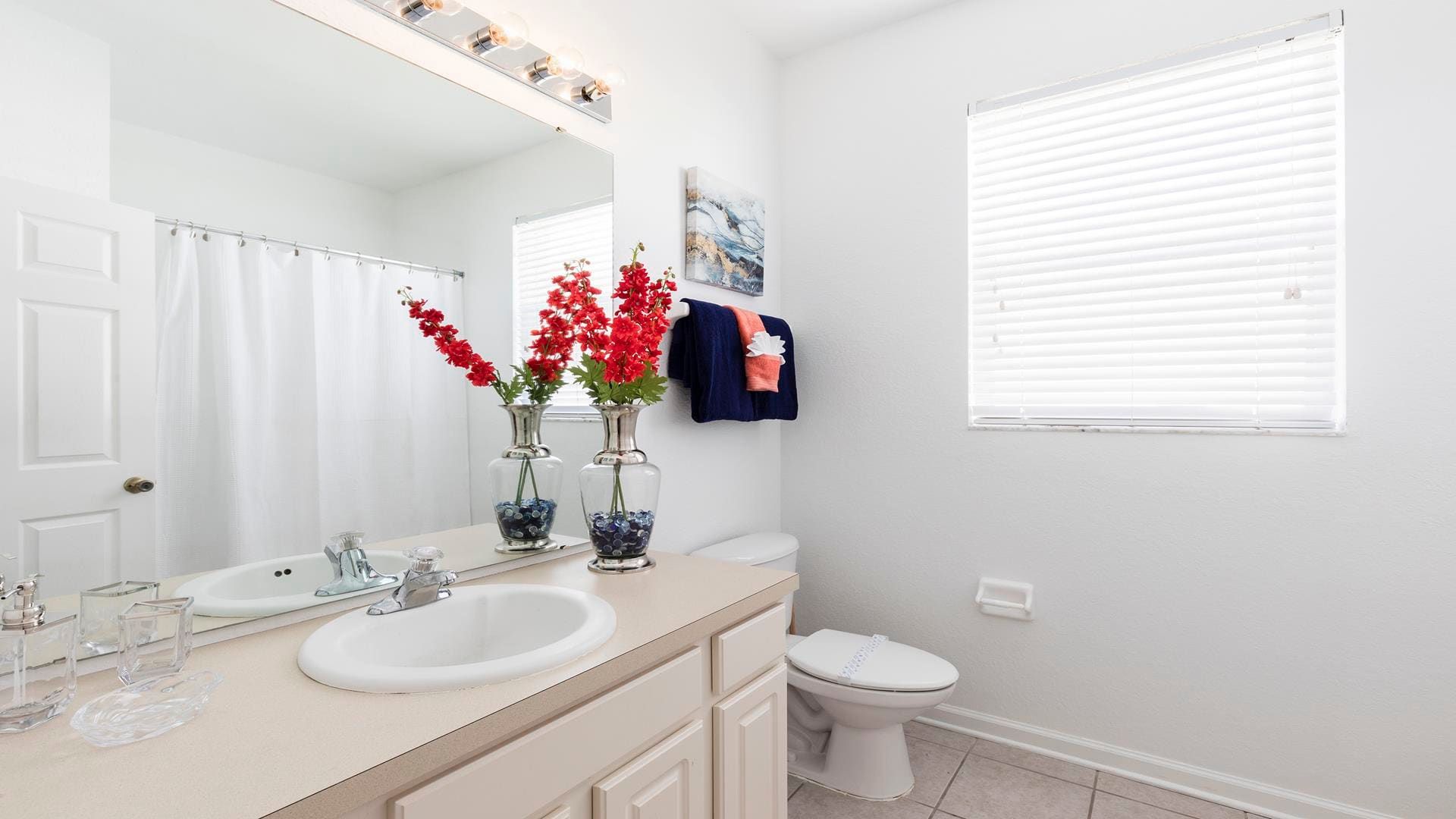Bright and stylish bathroom with elegant décor, fresh towels, and a cozy feel.