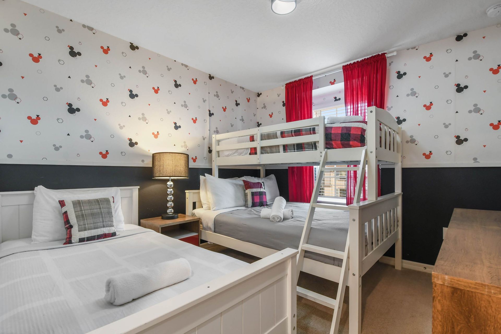 Disney-themed room with cozy beds, fun decor, and a playful family-friendly vibe.