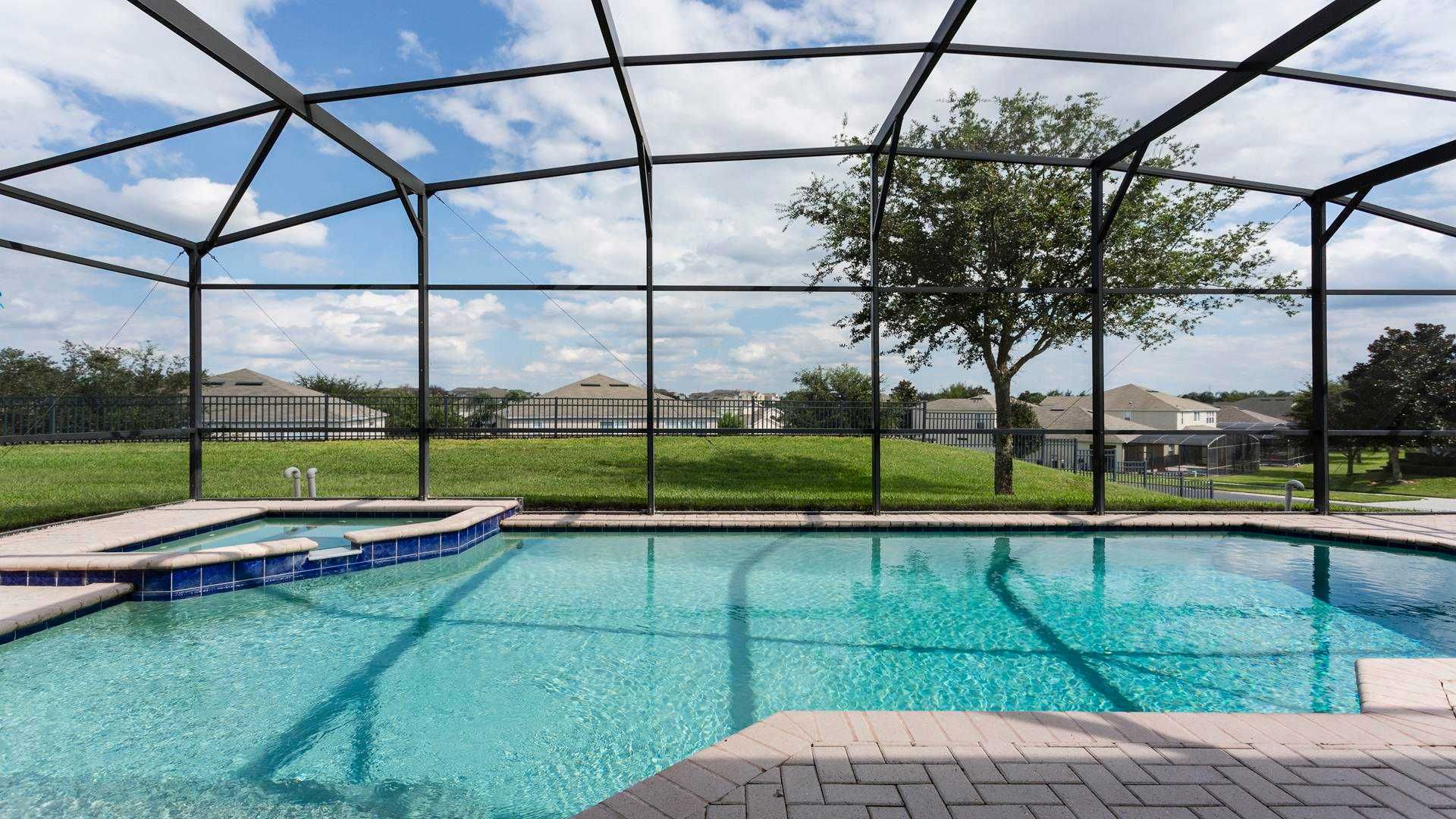 Relax in a private screened pool with no rear neighbors, just minutes from Disney.