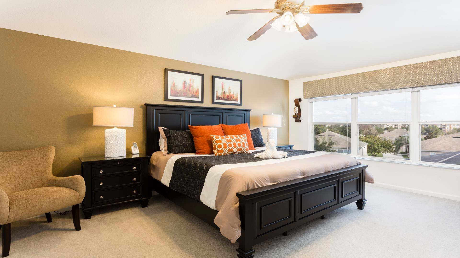 Luxurious master bedroom with a king bed, stylish decor, and stunning natural light.