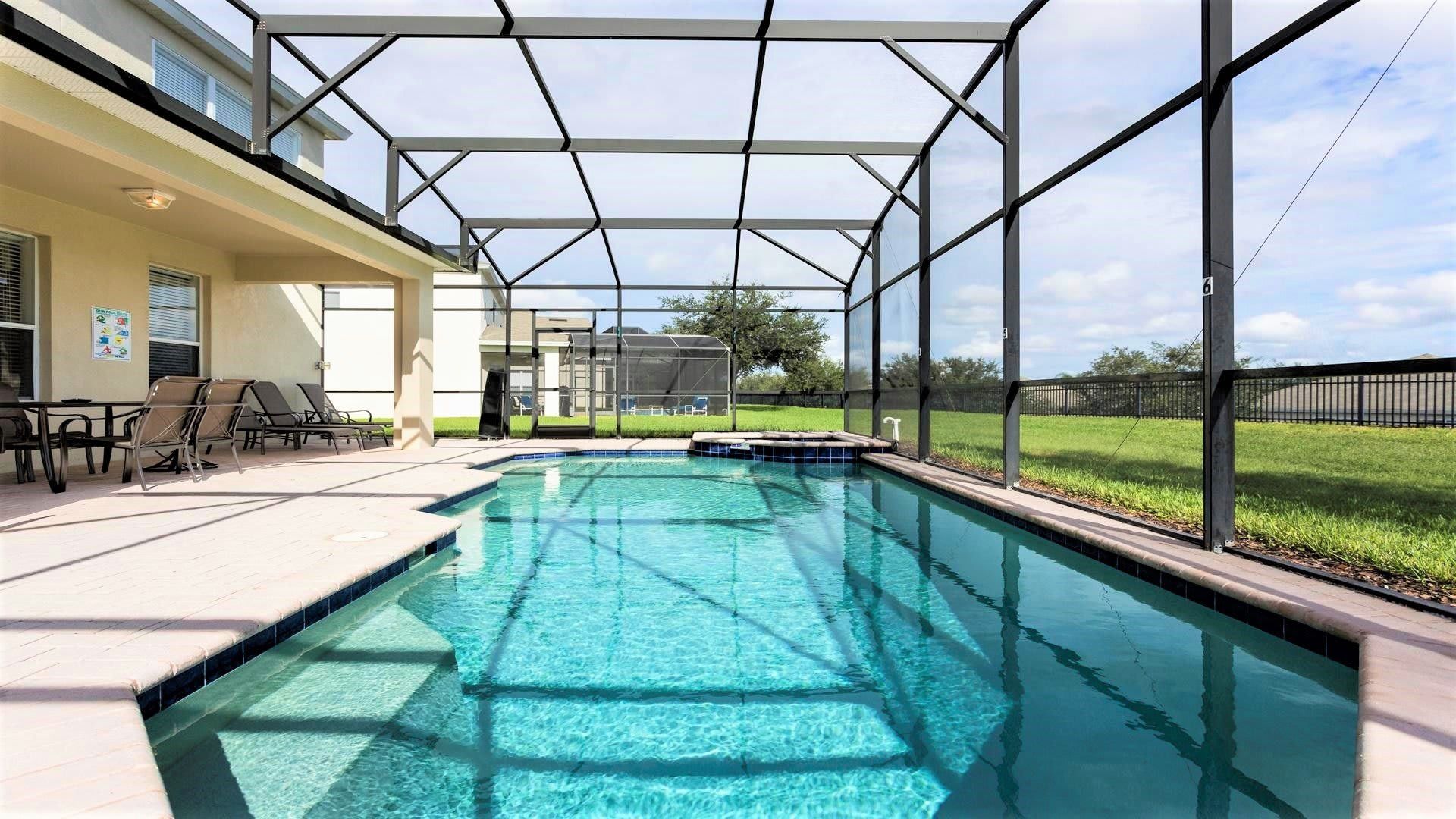 Private screened pool with spa, spacious patio, and no rear neighbors for total relaxation.