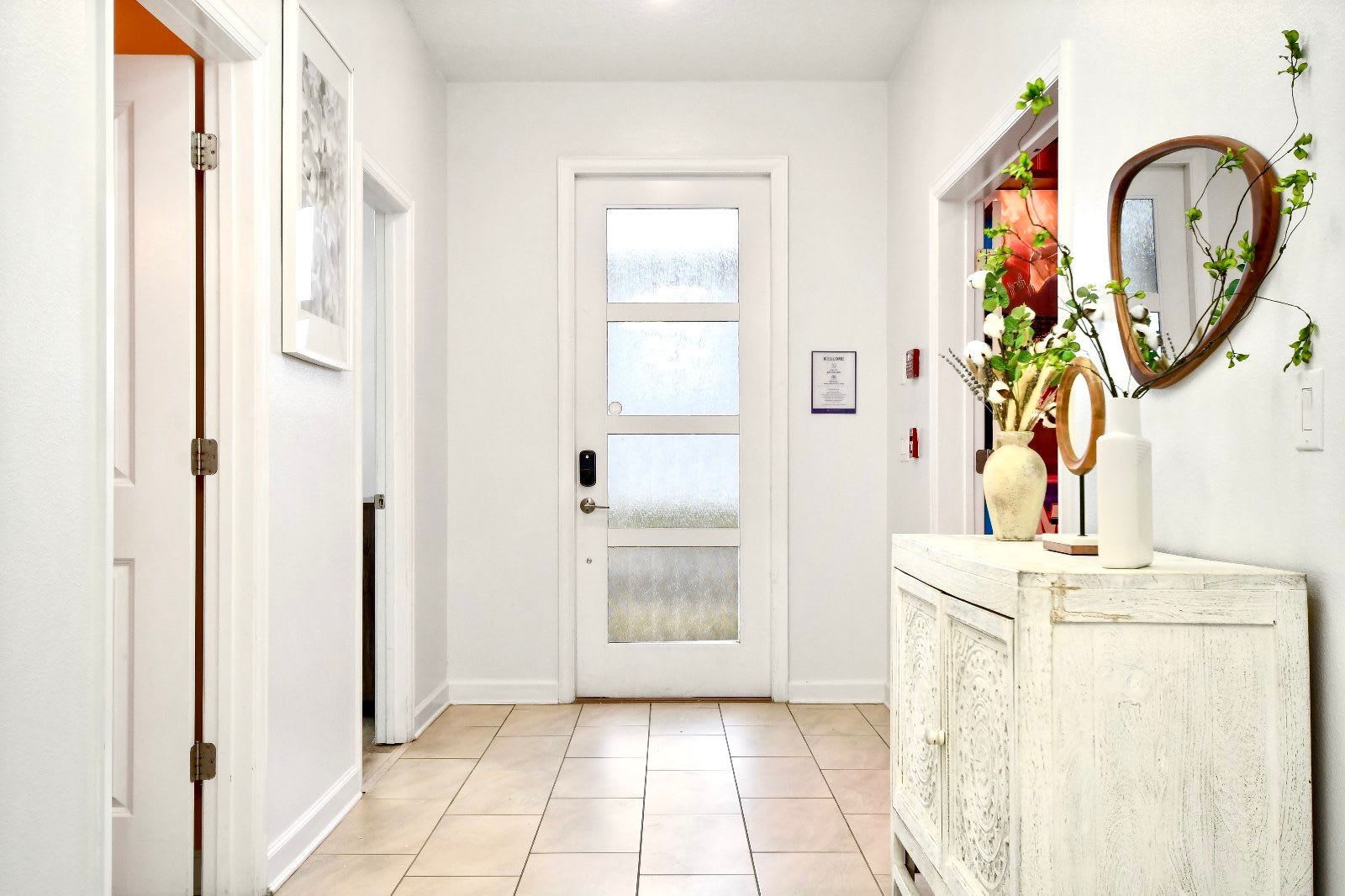 Step into a bright, elegant entryway with modern decor and a welcoming vibe.