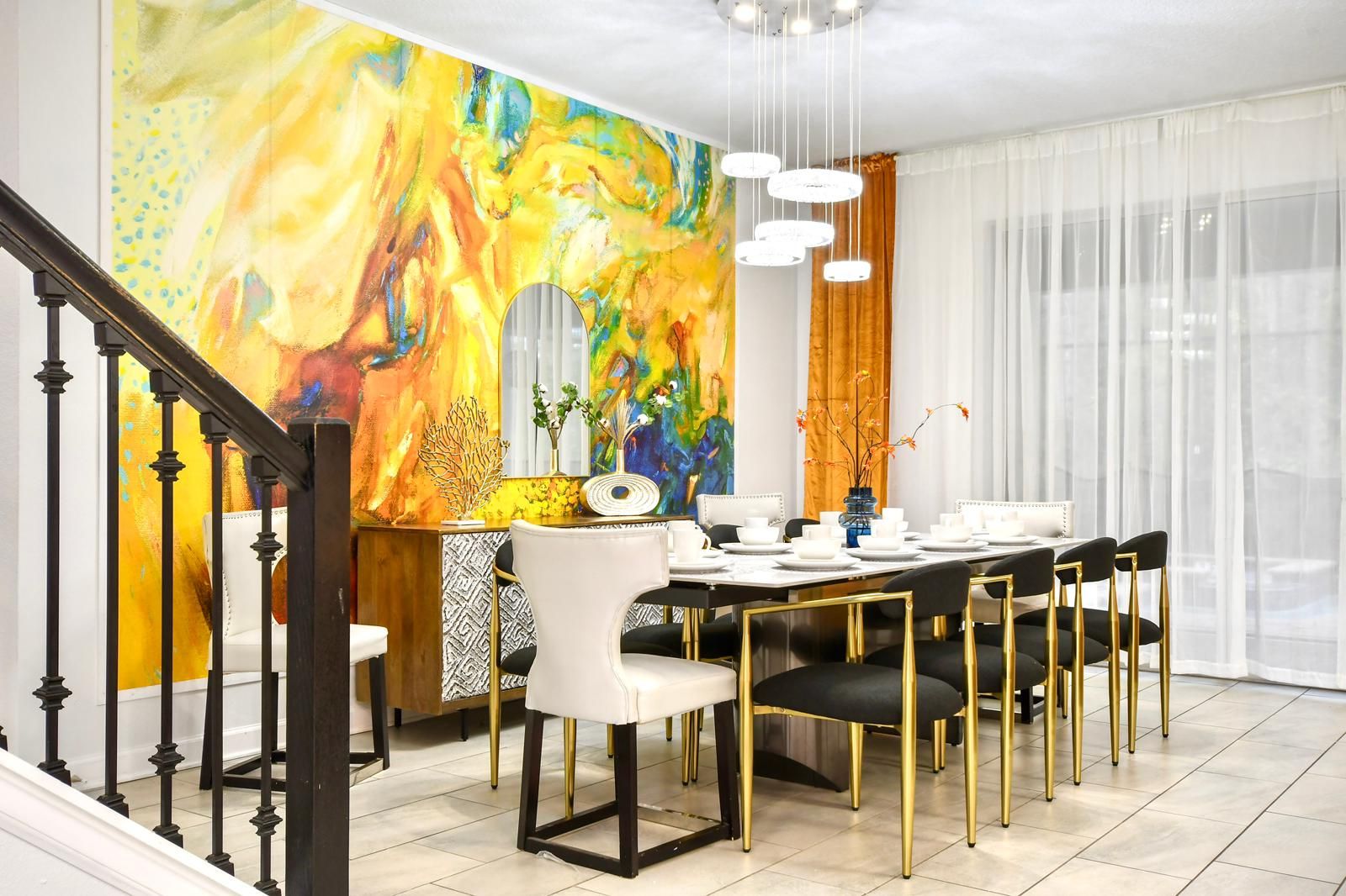 Elegant dining space with bold artistic accents, modern decor, and luxurious seating.