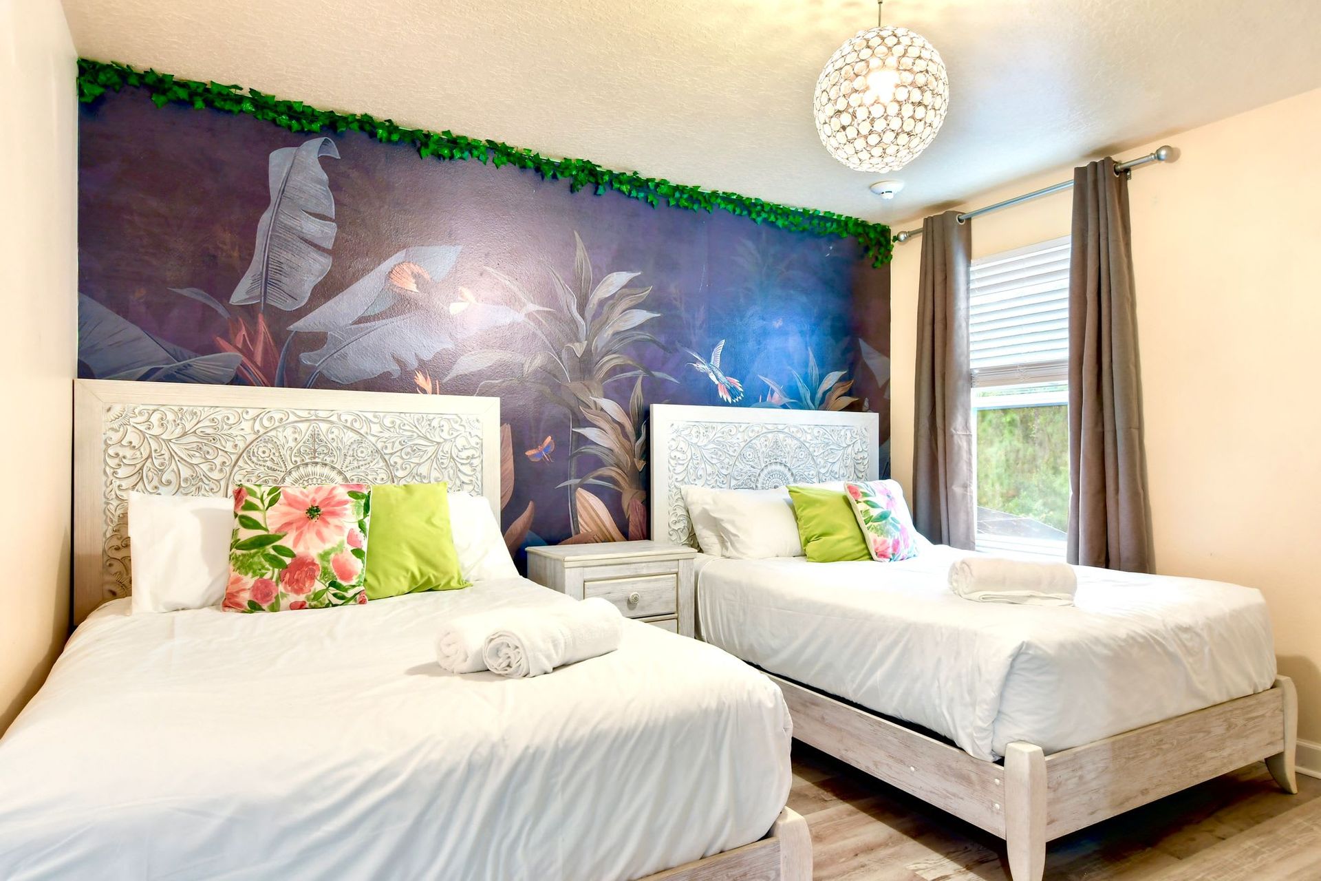 Tranquil nature-inspired bedroom with elegant carved beds, lush decor, and soft lighting.