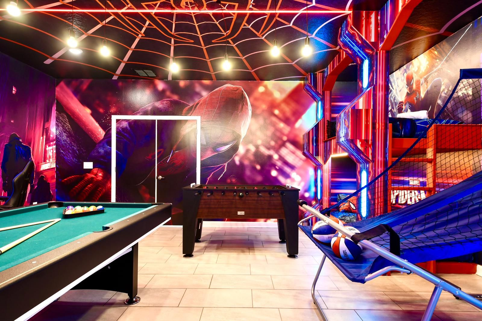 Epic Spider-Man-themed game room with bunk beds, arcade games, pool, and foosball.