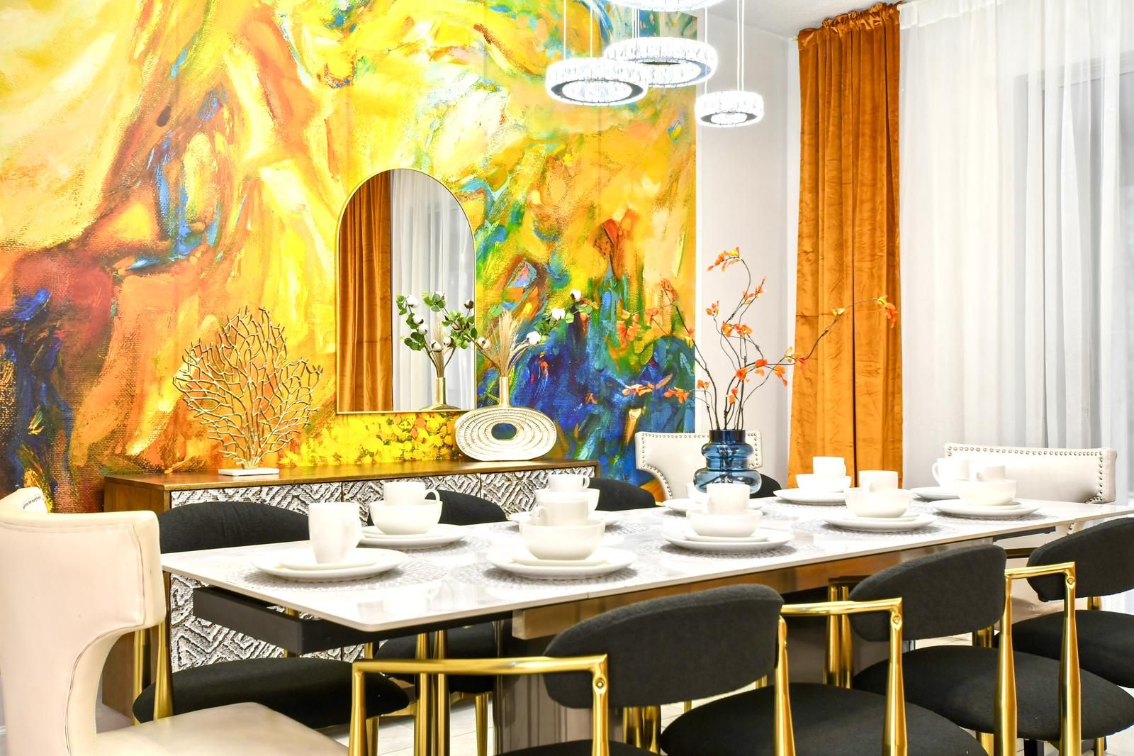 Vibrant dining space with bold artwork, elegant decor, and a stylish modern touch.