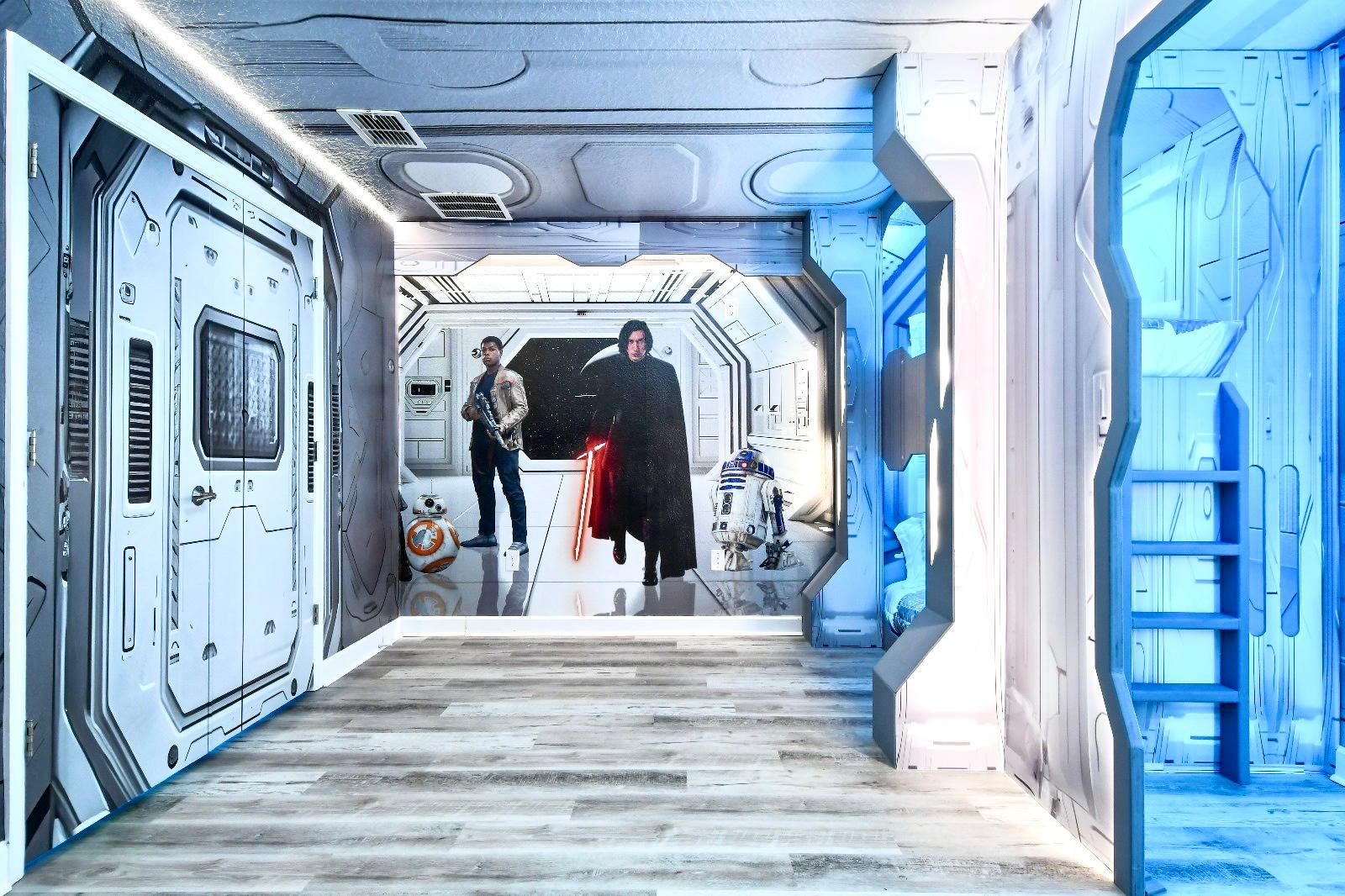 Immersive Star Wars-themed room with spaceship-style decor and glowing bunk beds.