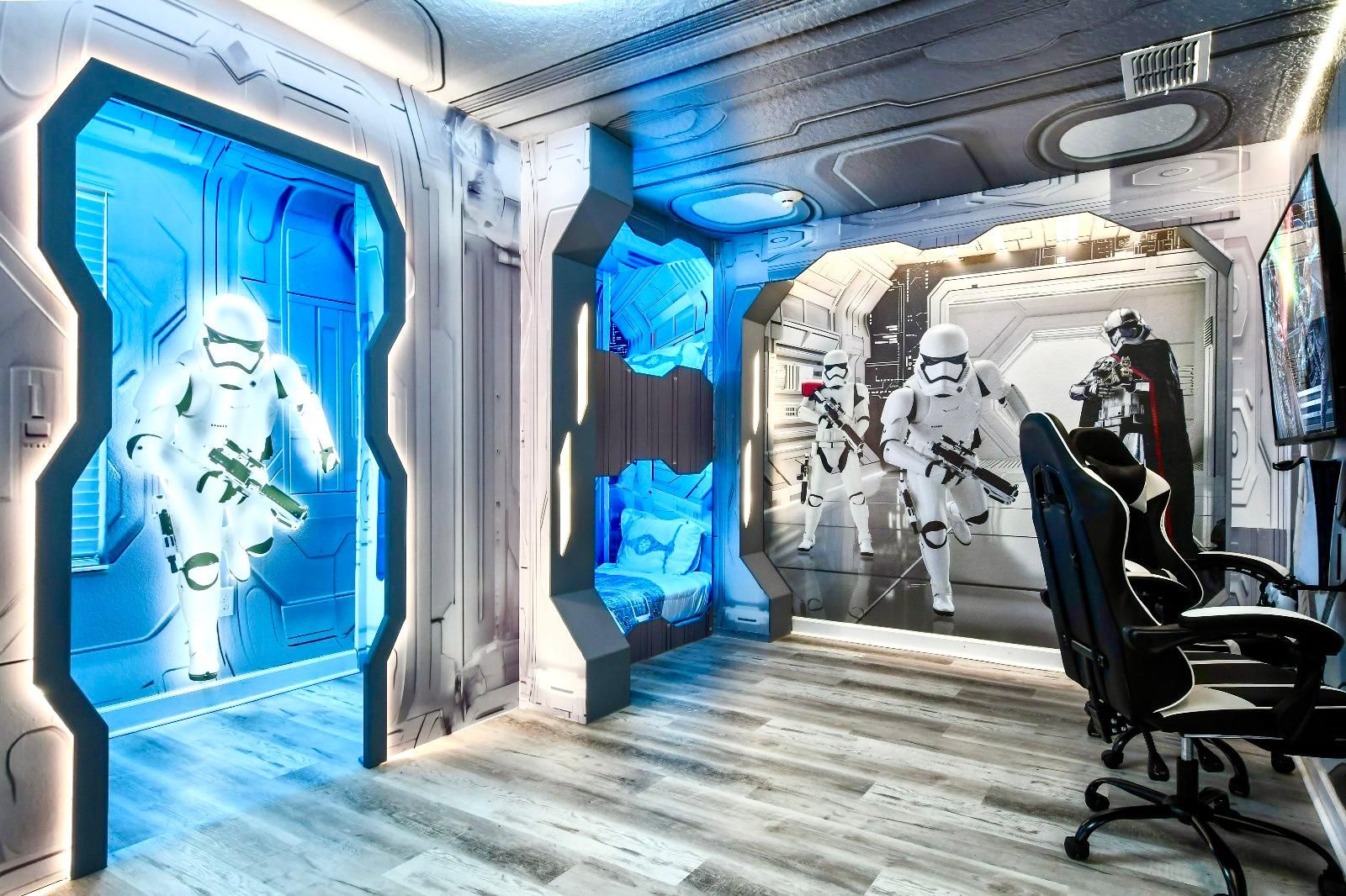 Immersive Star Wars-themed room with bunk beds, gaming setup, and galactic decor.