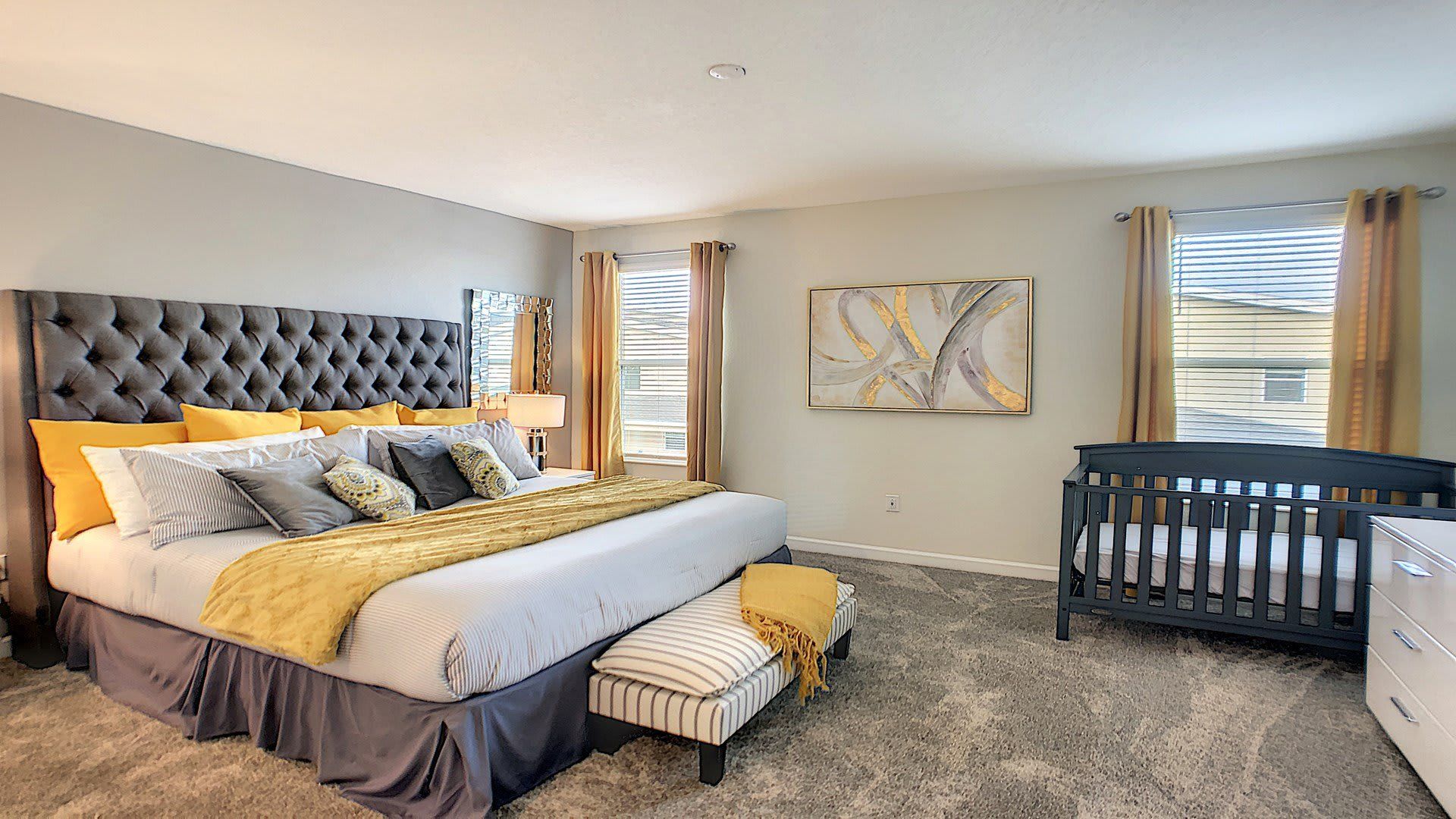 The master bedroom on the ground floor with a luxuriously large king bed