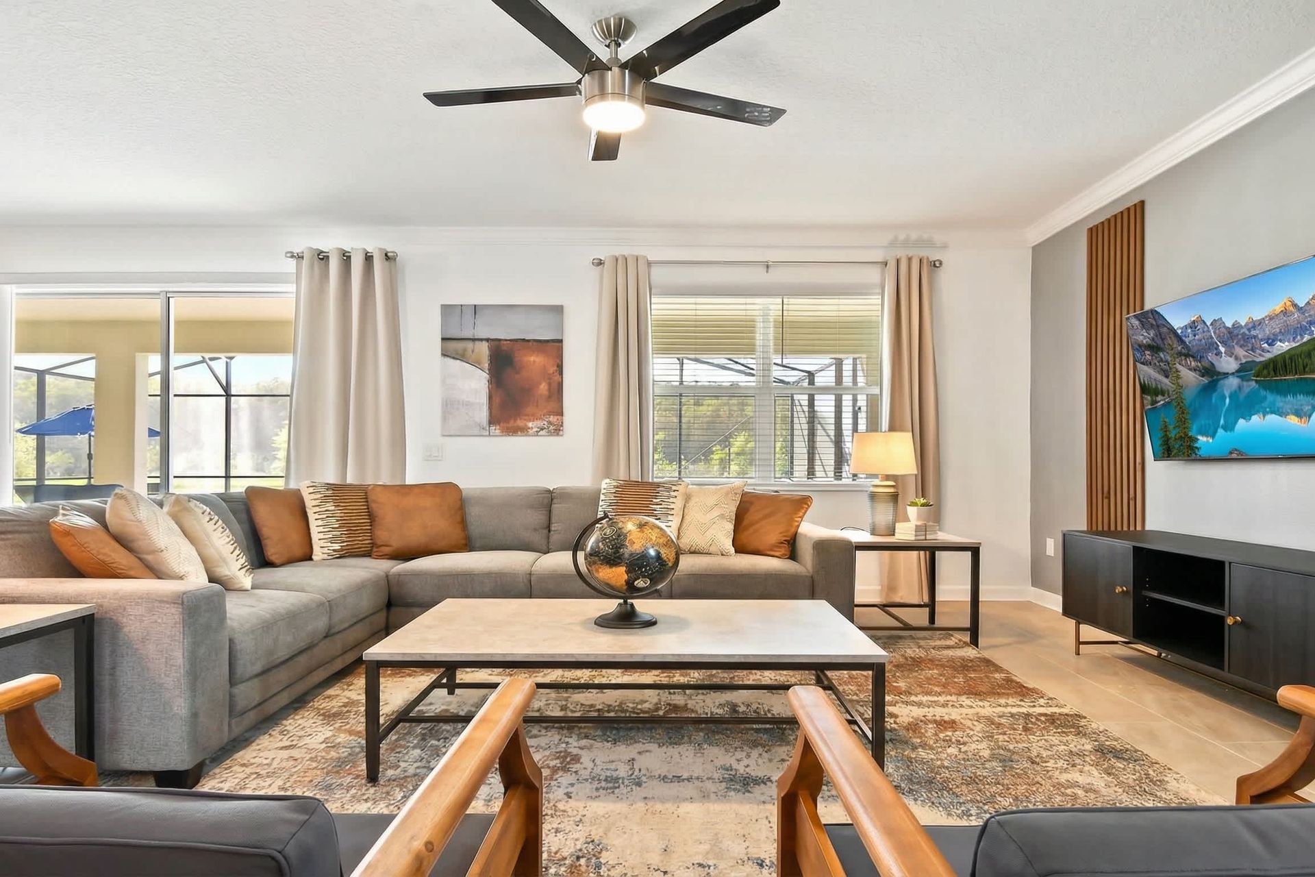 Generously sized living room featuring a cozy sofa, creating an inviting and comfortable space ideal for cherished family reunions and quality time together.