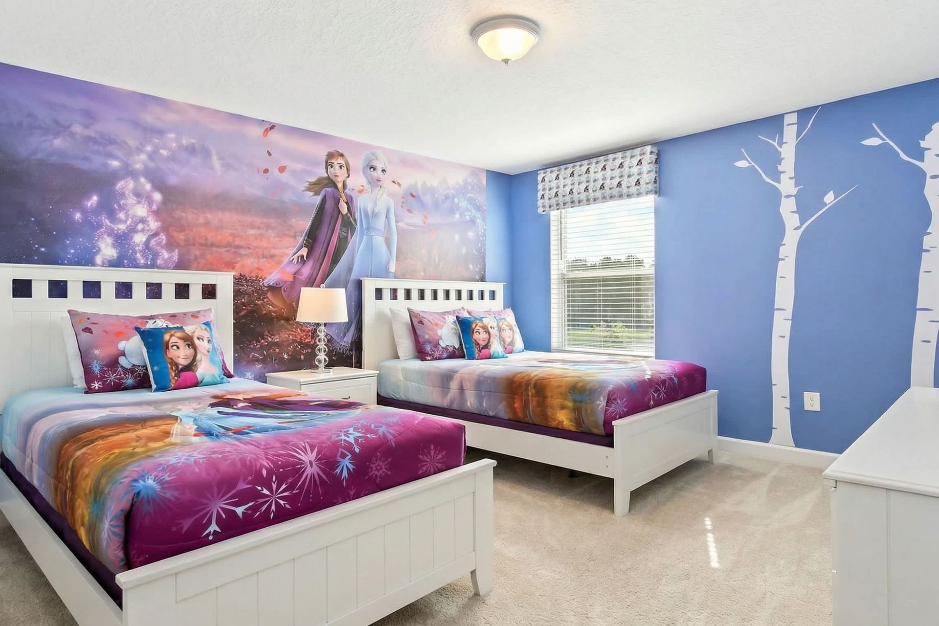 Immerse yourself in a Frozen-themed bedroom, where icy blues and enchanted decor transport the room into the magical world of Elsa and Anna.