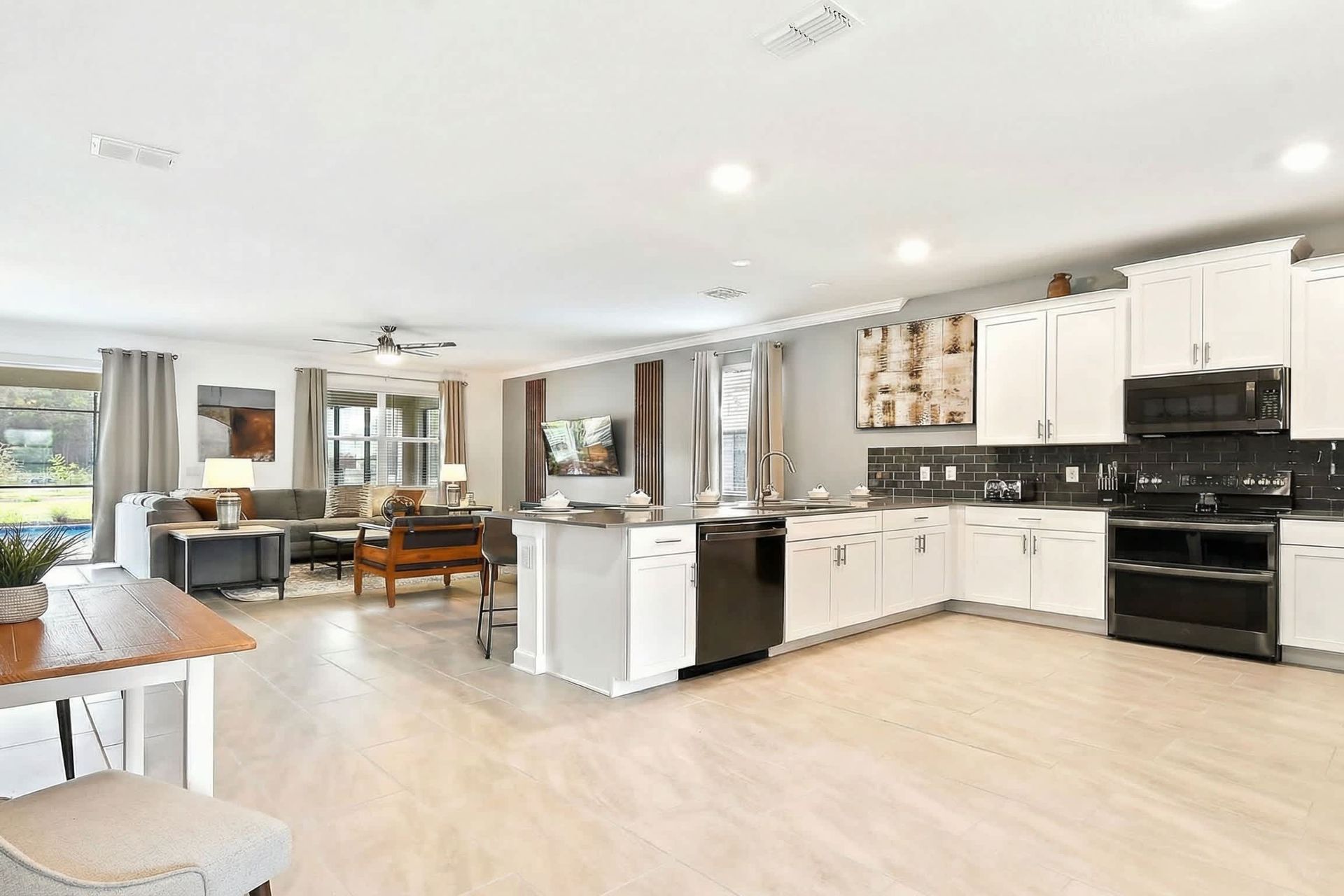 The expansive chef's kitchen is fully equipped with all the amenities and tools you could possibly need.