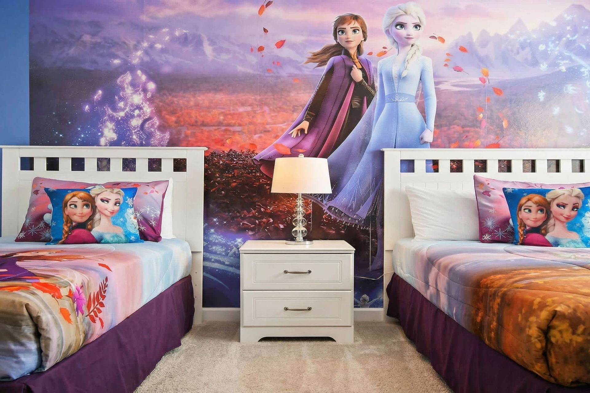 Immerse yourself in a Frozen-themed bedroom, where icy blues and enchanted decor transport the room into the magical world of Elsa and Anna.