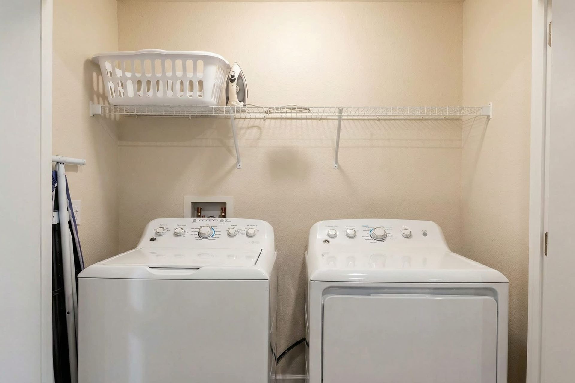 Dedicated laundry space equipped with a washer and dryer for convenient and efficient laundry tasks.