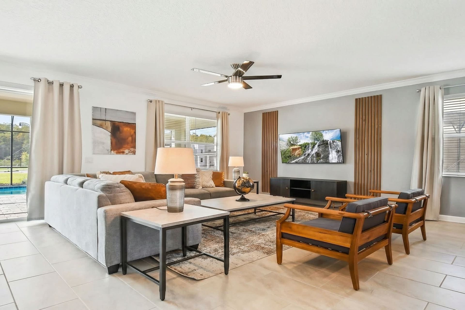 Generously sized living room featuring a cozy sofa, creating an inviting and comfortable space ideal for cherished family reunions and quality time together.