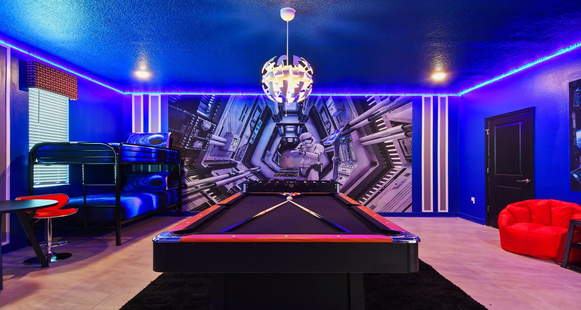 Innovative bedroom design seamlessly integrating a pool table, offering a unique and entertaining space.