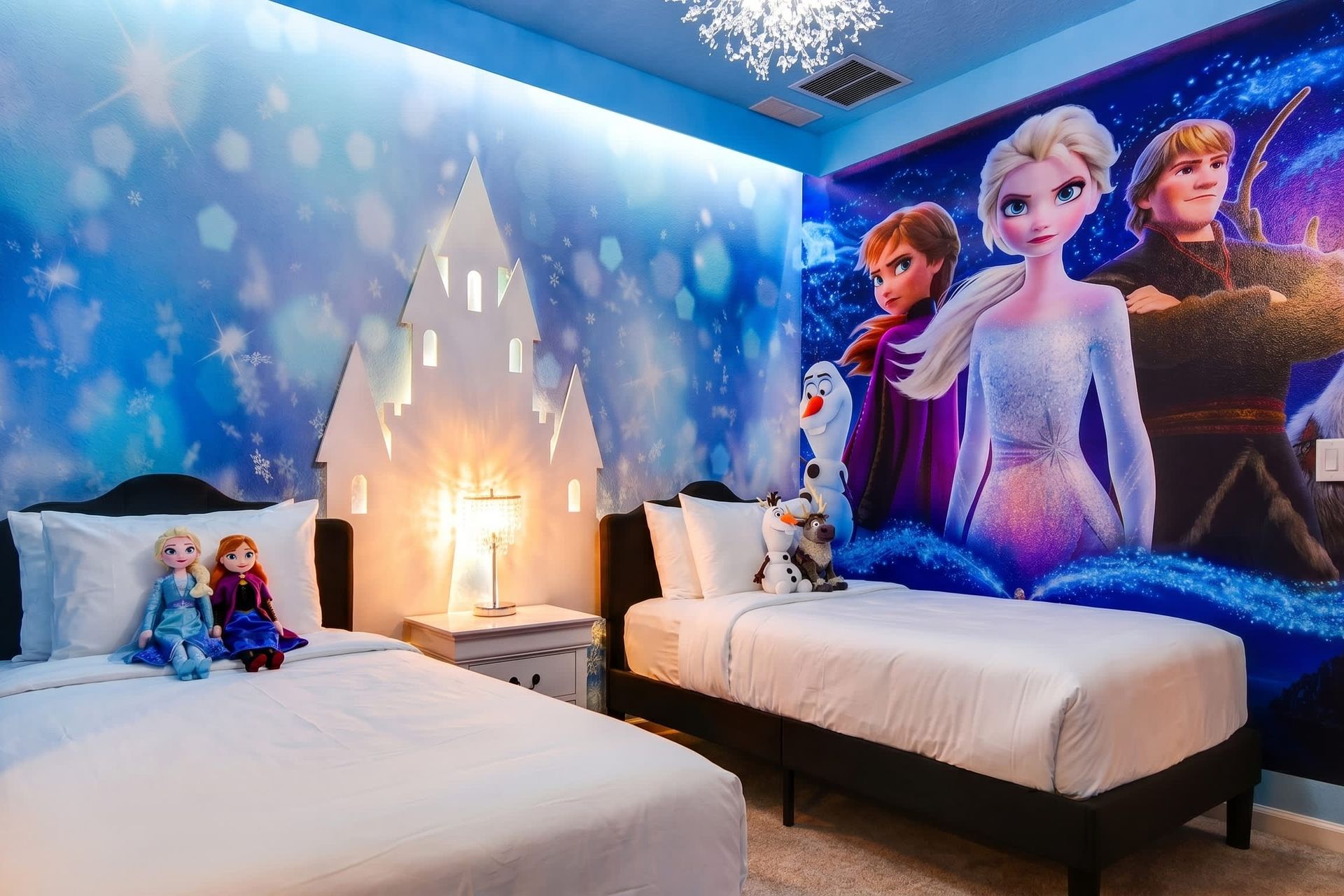 Frozen-themed bedroom with snowflake lighting and castle decor—magical for kids