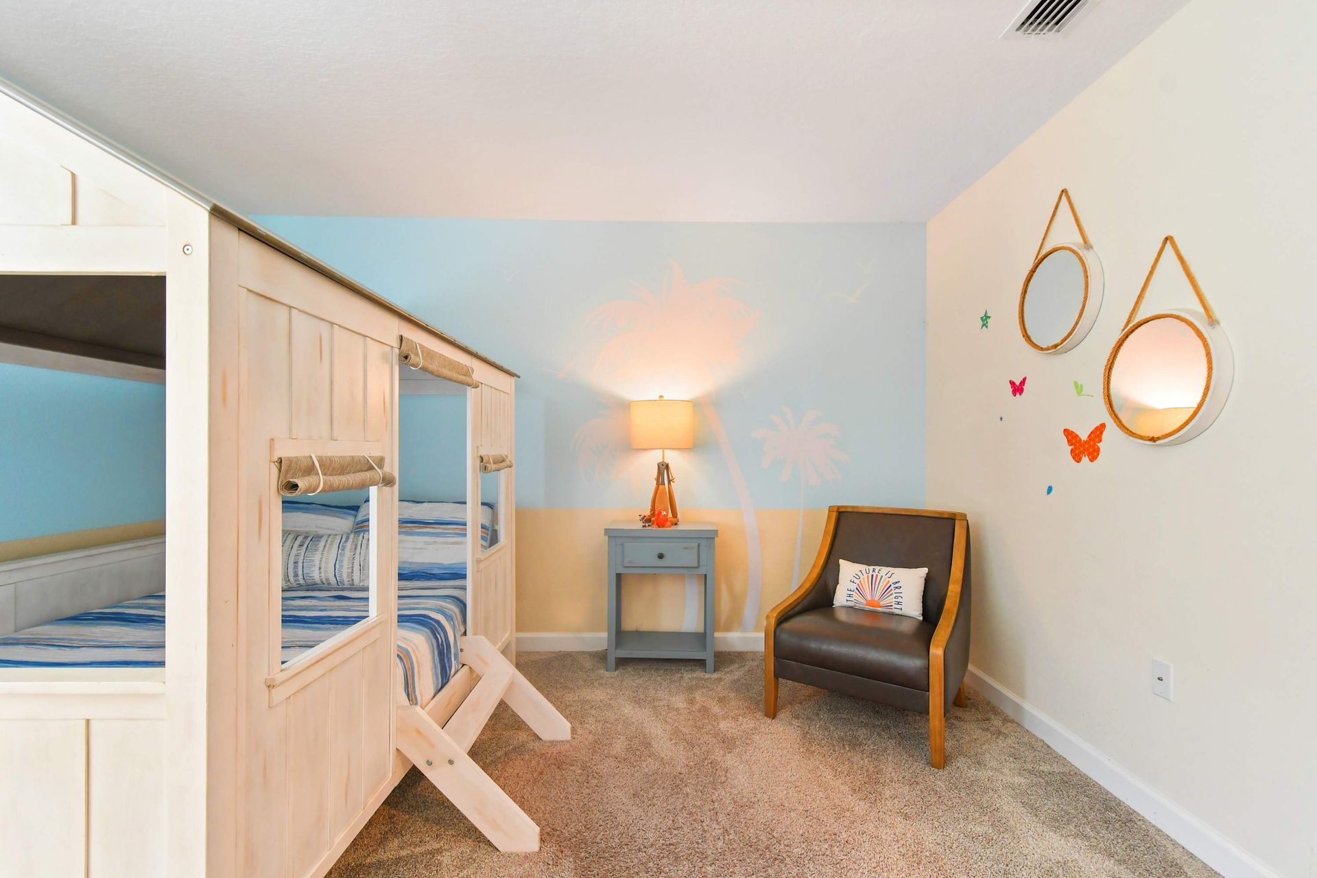 Whimsical beach-themed kids' room with a cozy bunk bed and playful coastal decor