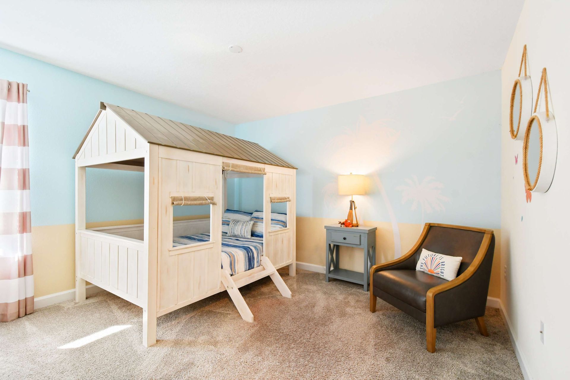 Charming beach-themed kids' room with a cozy bunk bed and playful decor