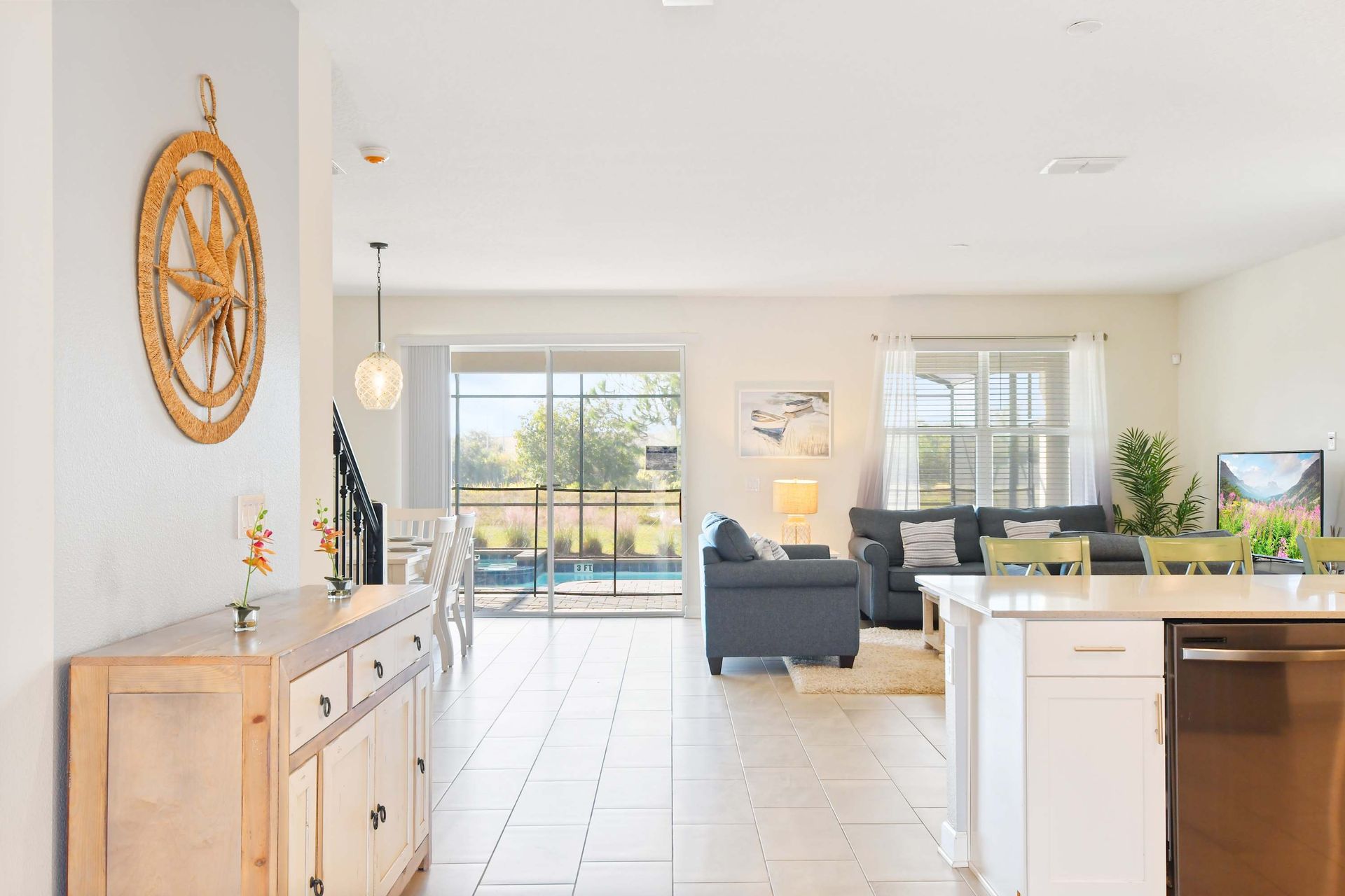 Spacious open-concept home with stylish decor, natural light, and a private pool