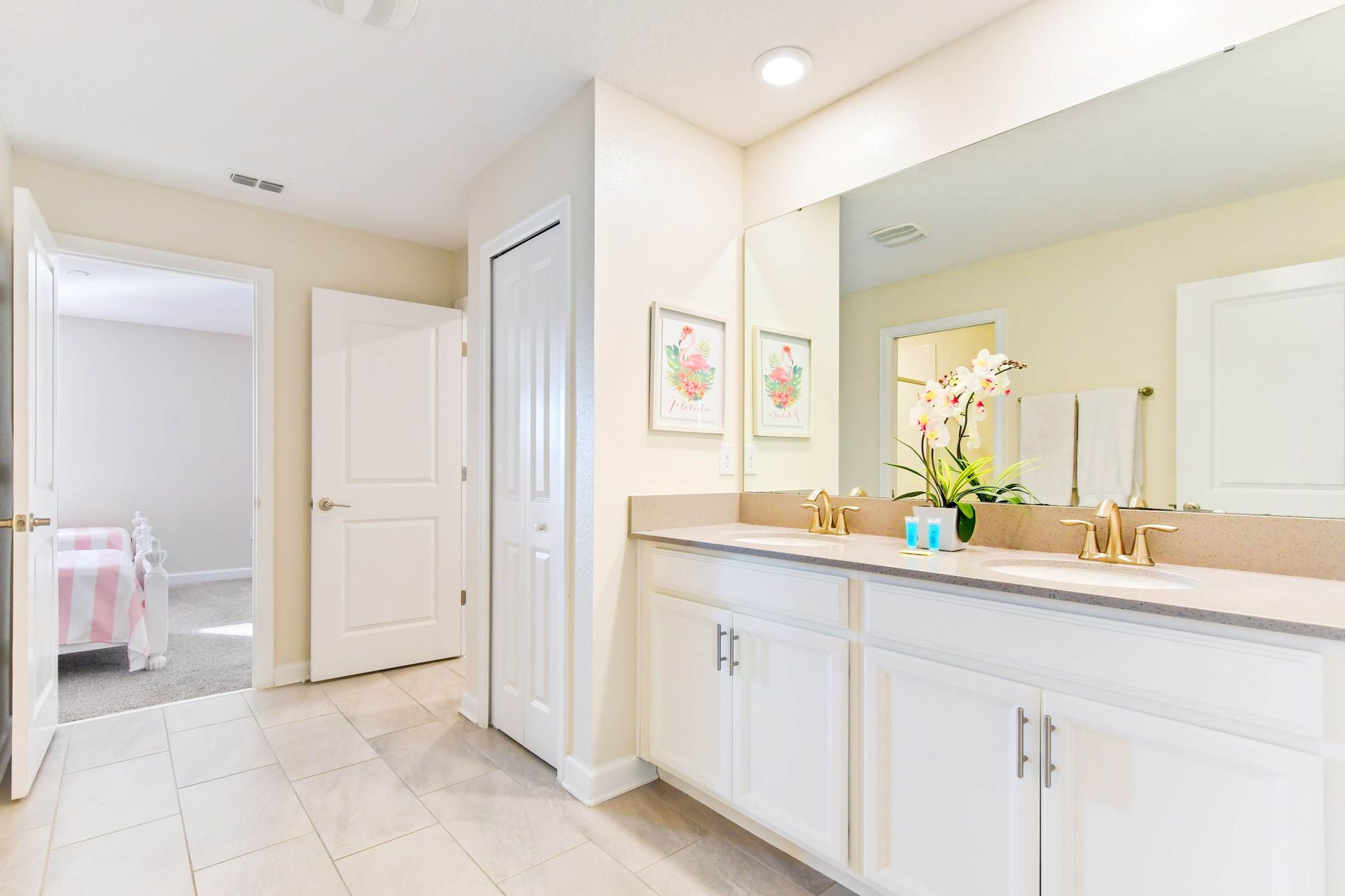 Elegant bathroom with a dual vanity, soft decor, and bright, refreshing ambiance