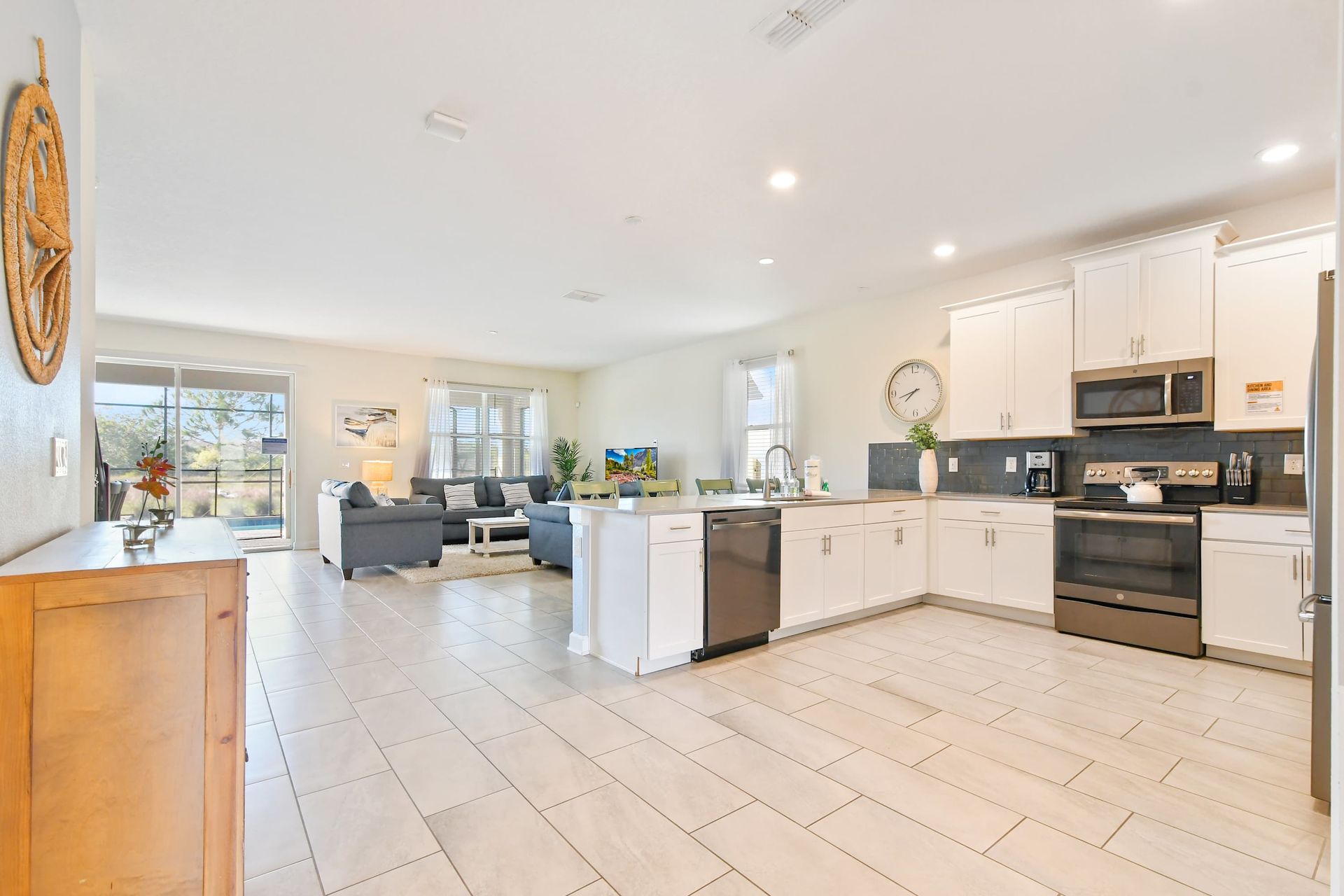 Spacious open-concept kitchen and living area with modern finishes and natural light