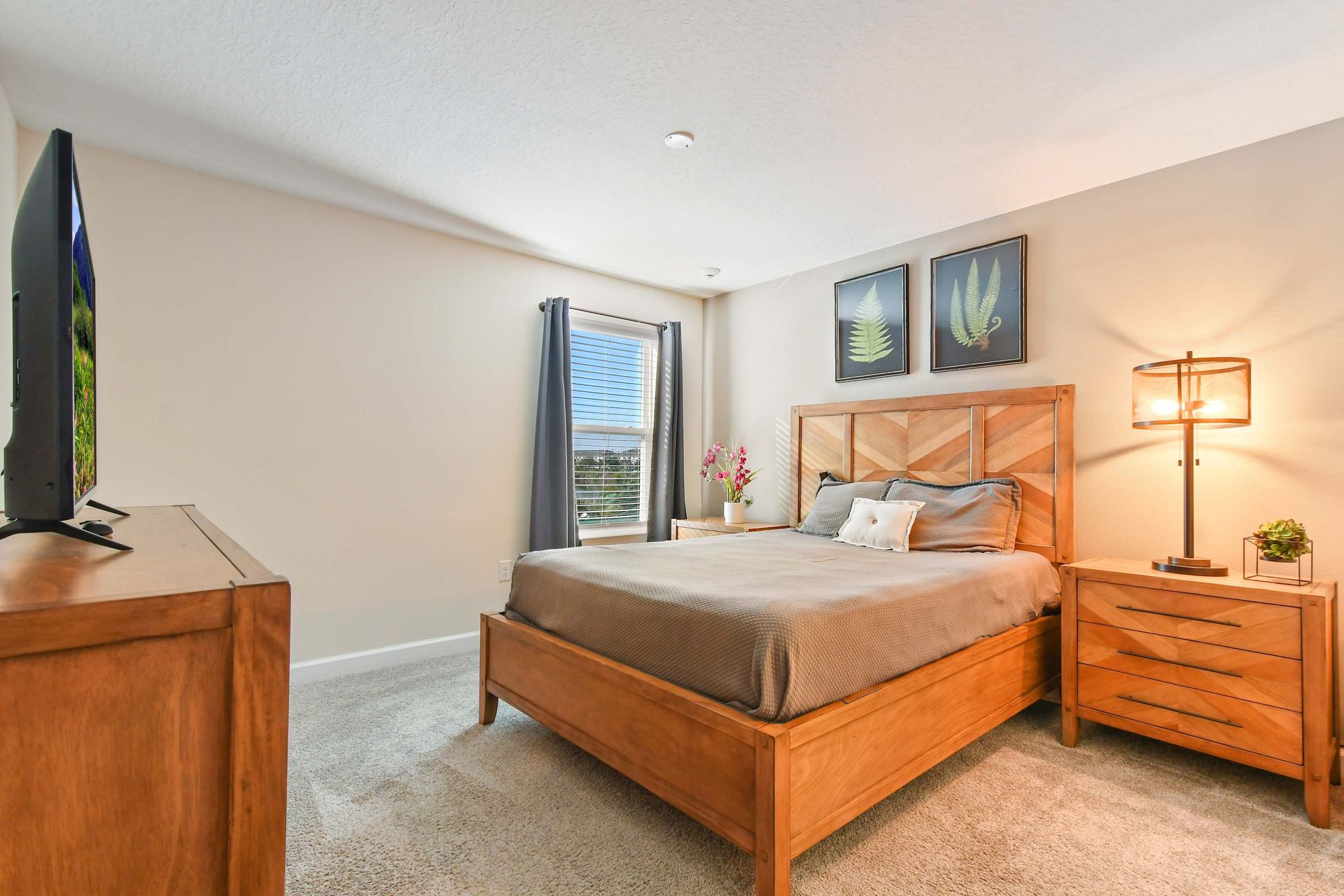 Modern rustic bedroom with warm wood furnishings, soft lighting, and cozy ambiance