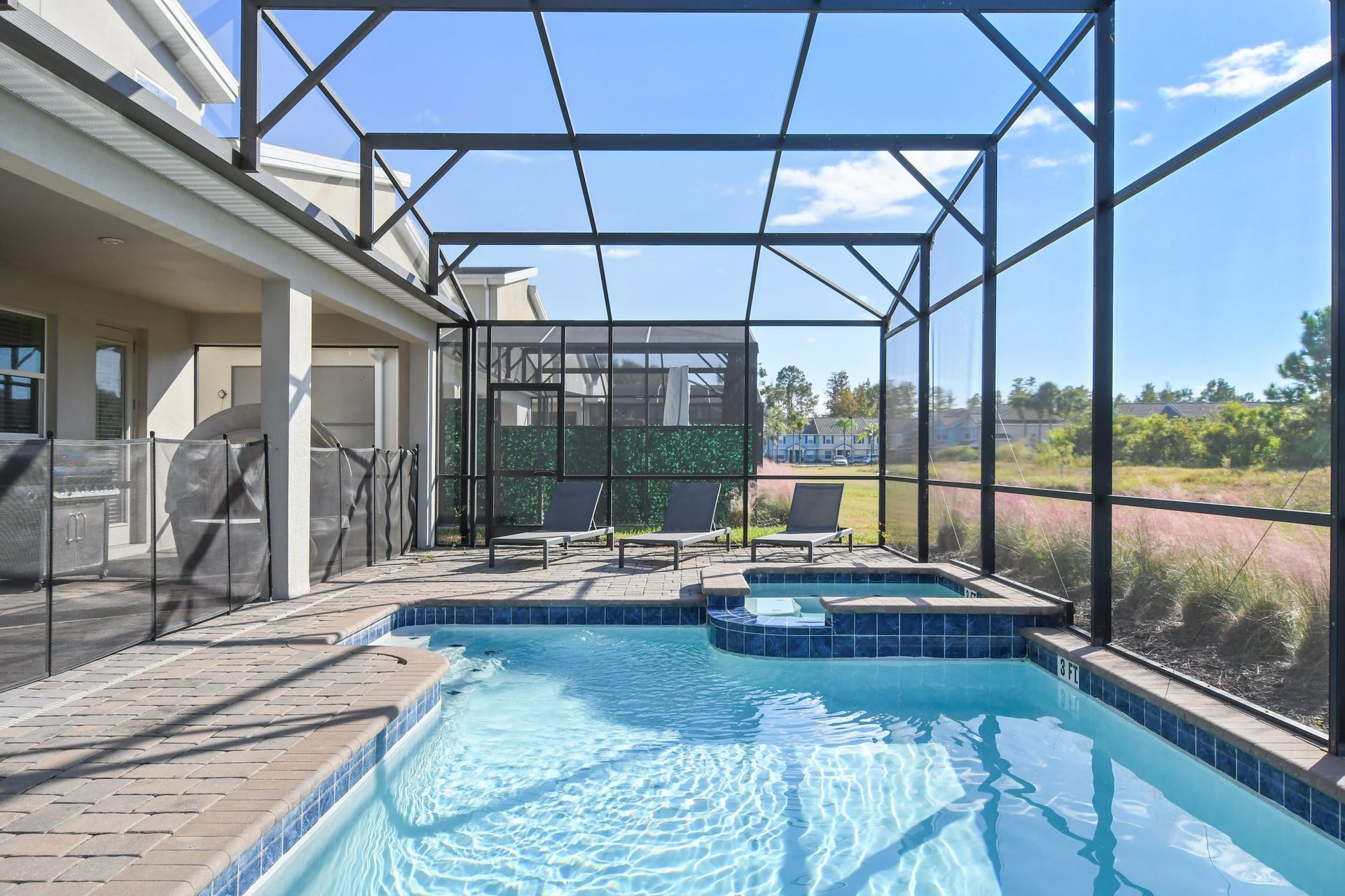 Screened private pool and spa with scenic views, sunny patio, and relaxing ambiance