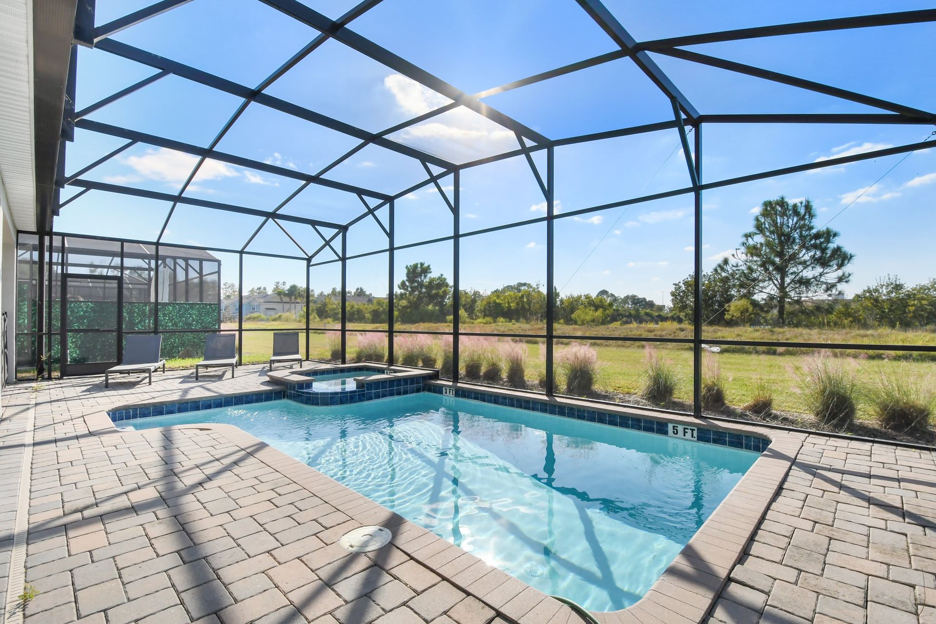 Screened private pool and spa with scenic views, sunny patio, and relaxing ambiance
