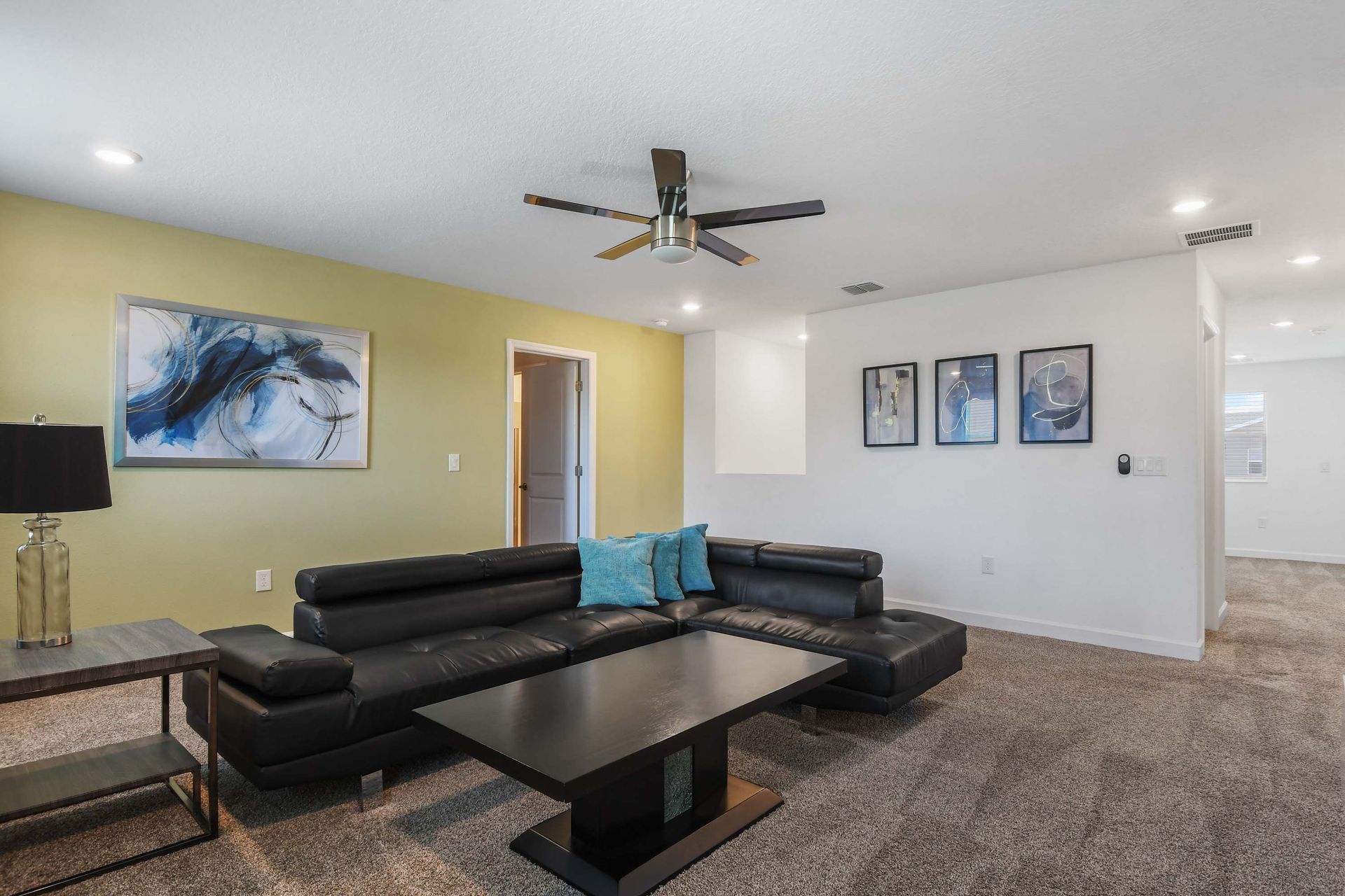 Modern loft with a sleek sectional, stylish decor, and a cozy space for relaxation.