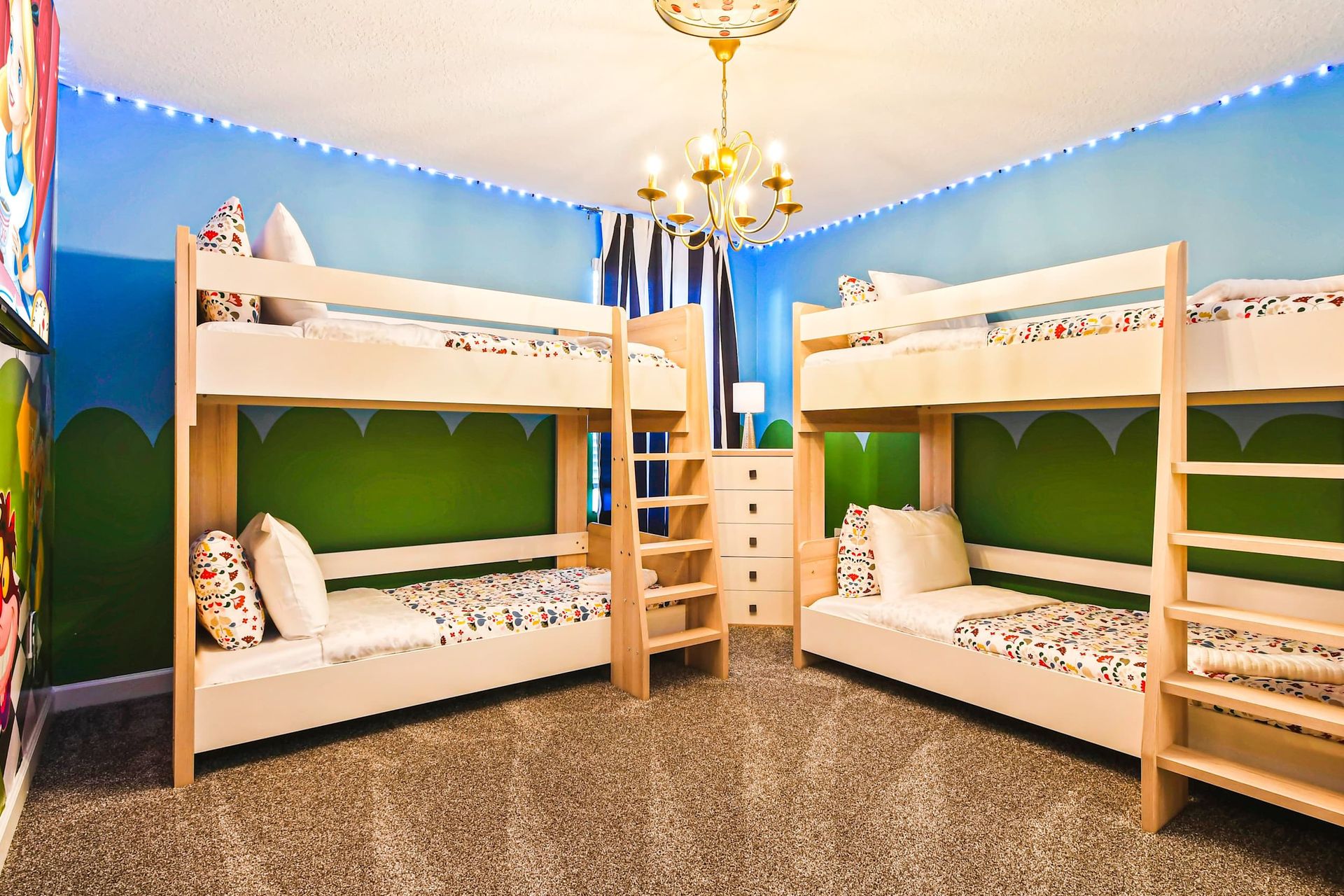 Whimsical themed bunk room with playful decor, cozy bedding, and fun lighting.