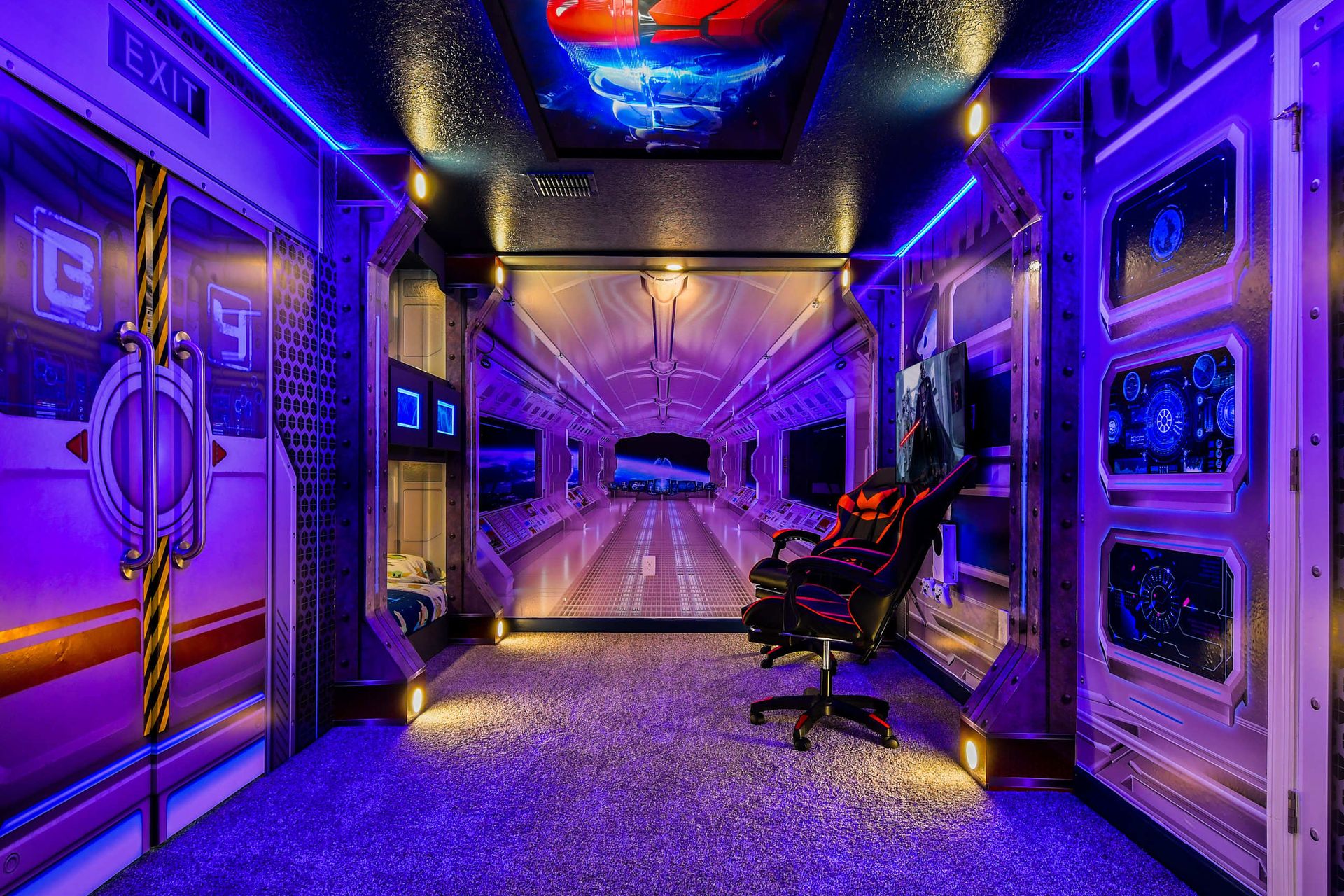 Futuristic space-themed room with glowing LED lights, gaming setup, and bunk beds.