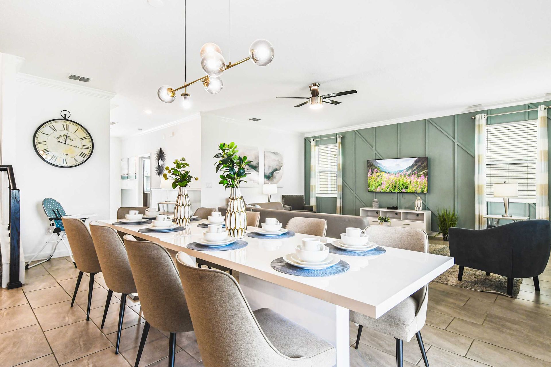 Stylish open dining and living space with modern decor, comfy seating and bright vibe
