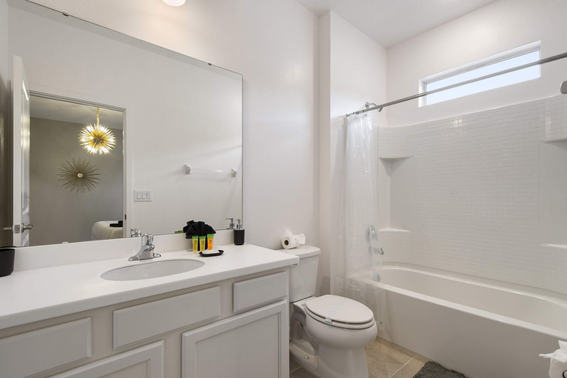 Bright and spotless bathroom with a clean tub and modern white finishes.