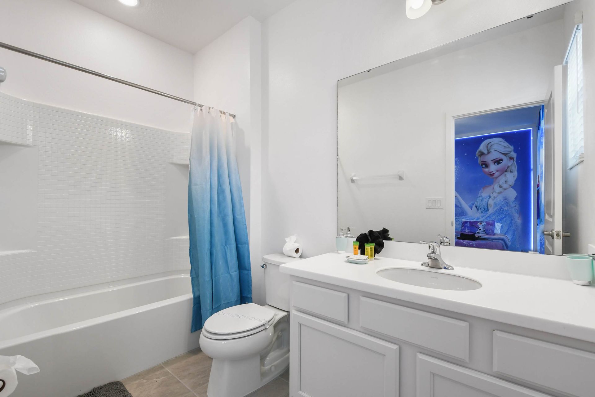 Bright and clean bathroom with modern fixtures and a relaxing shower-tub combo.
