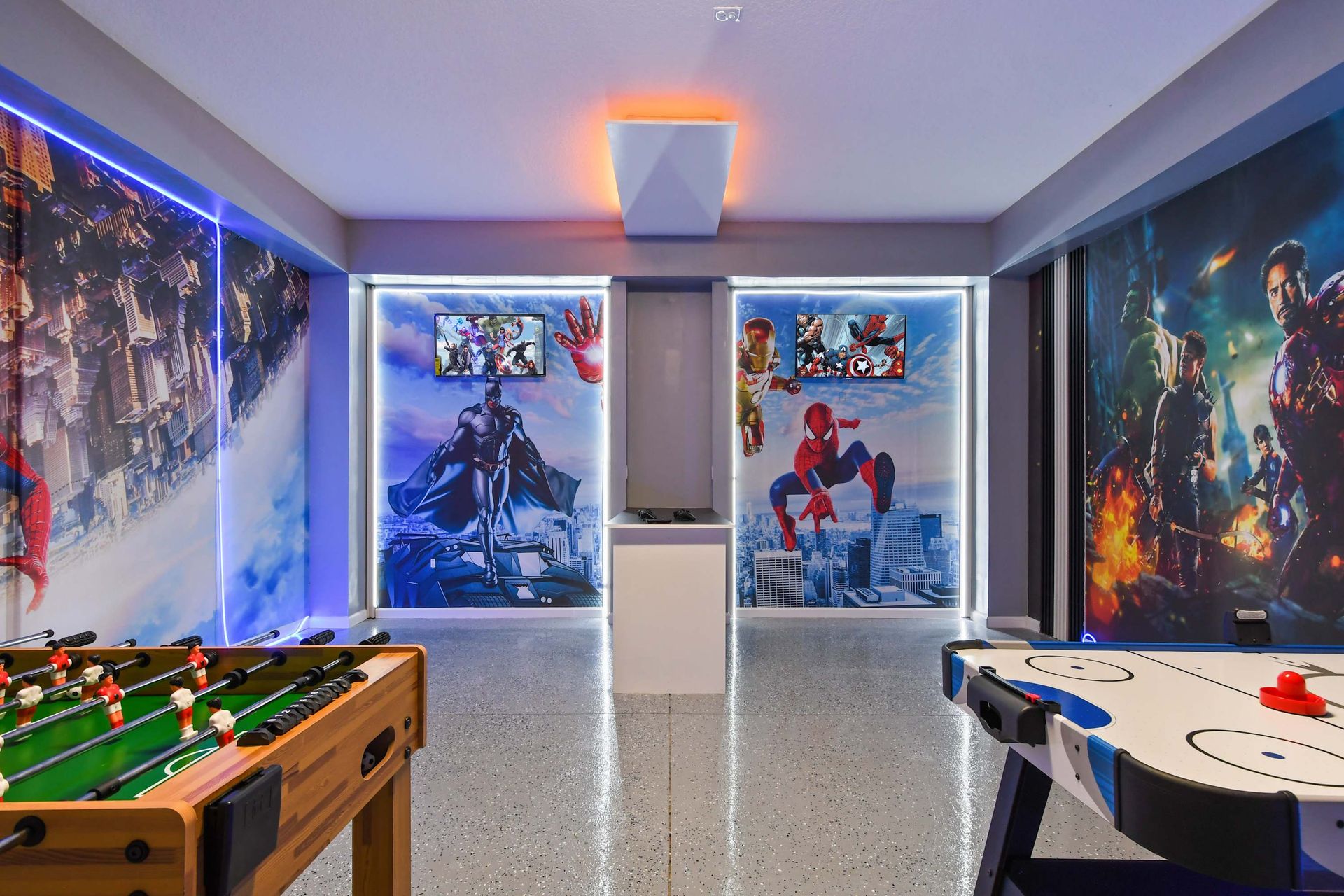 Epic game room with Spiderman murals, neon lighting, and arcade-style fun.