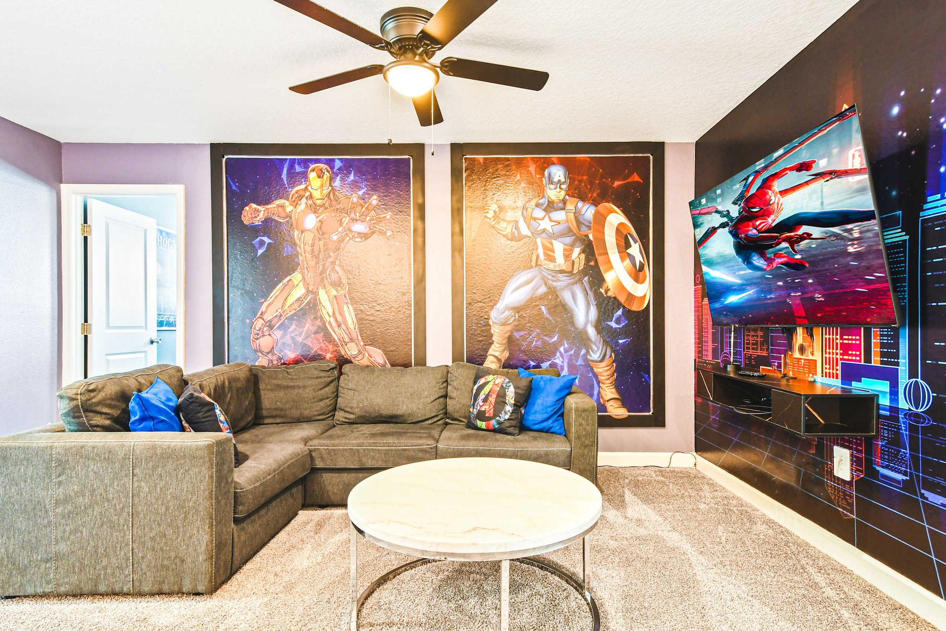 Unwind with your favorite heroes! Marvel-themed lounge with cozy seating and TV fun.