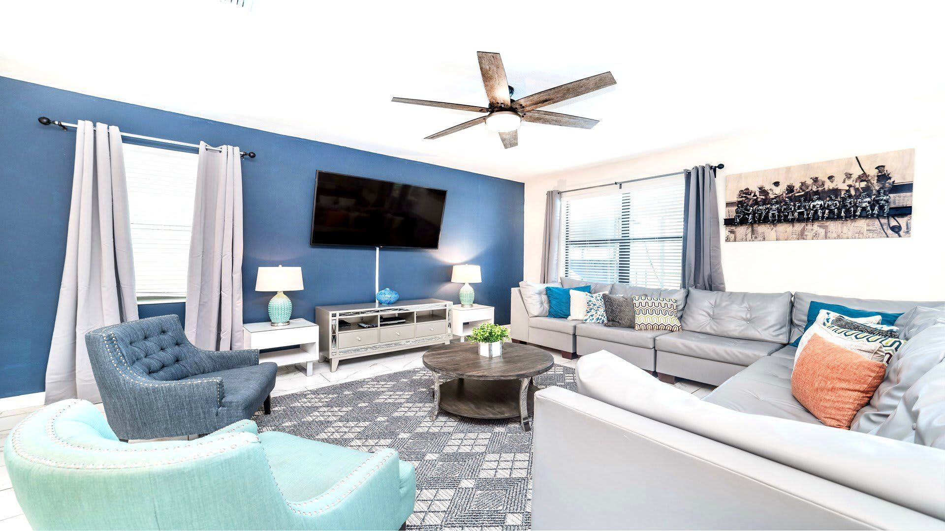 Bright and modern living room with cozy seating, smart TV, and stylish décor