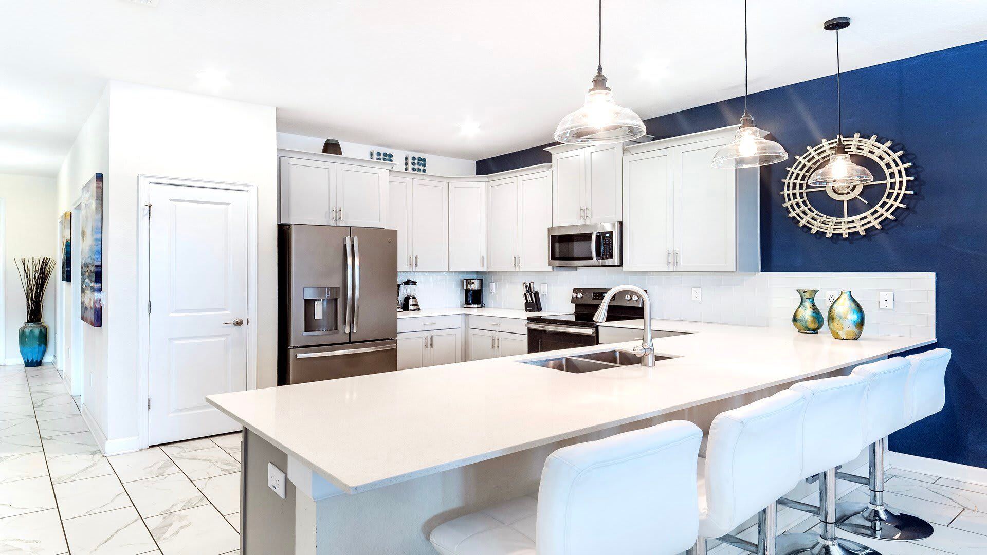 Modern chef’s kitchen with quartz counters, stainless steel appliances, and style