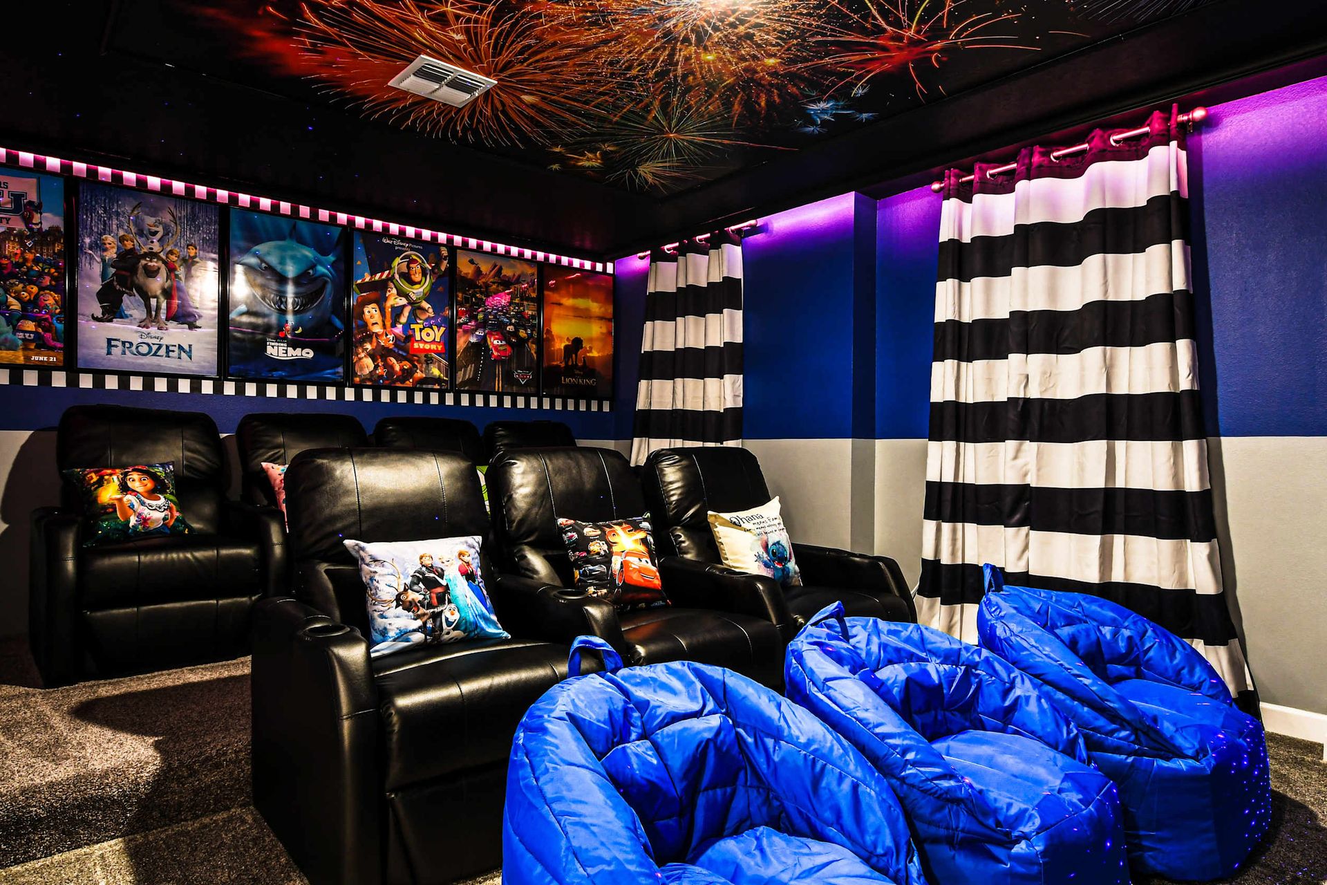 Private home theater with recliners, bean bags, and Disney magic all around.