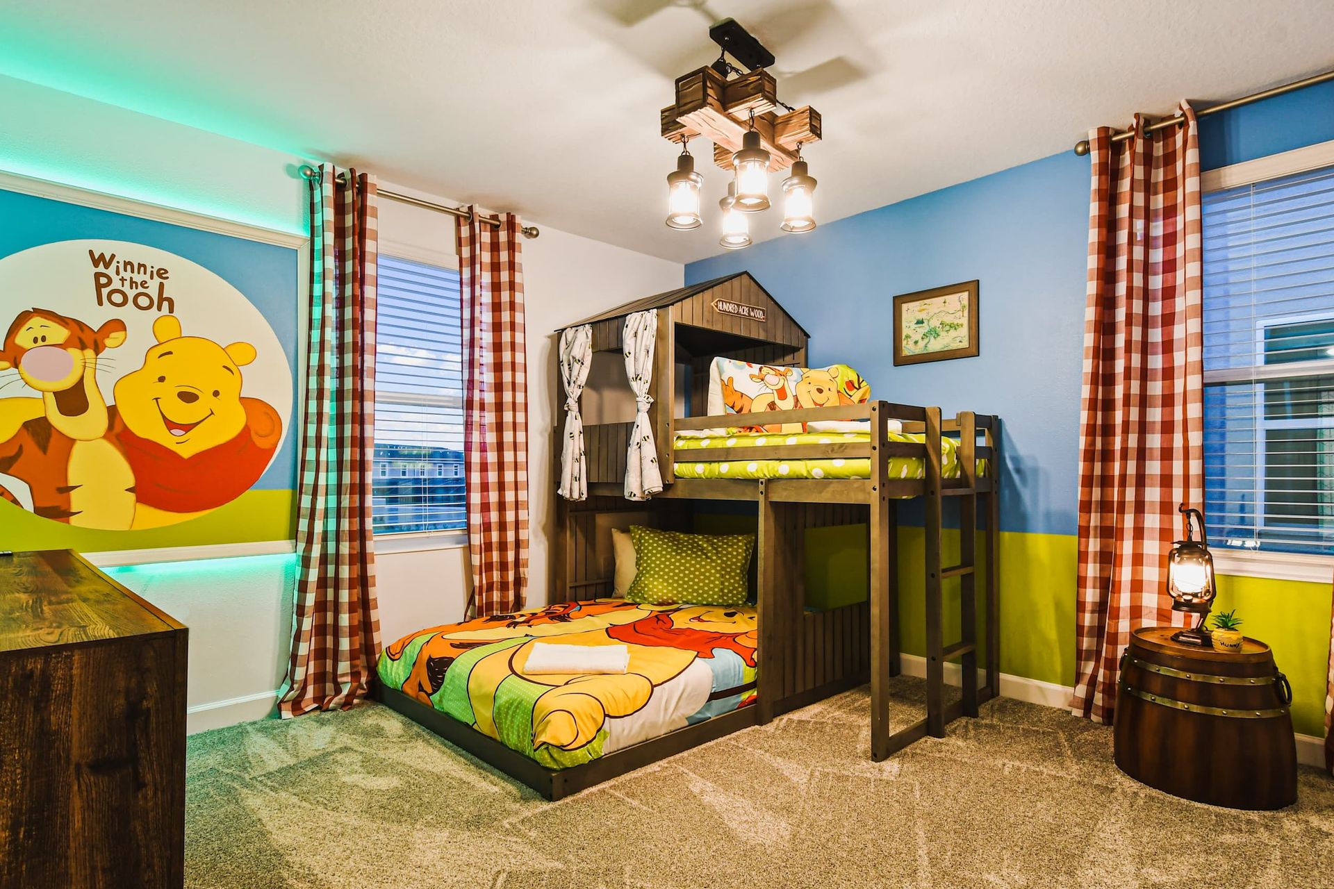 Whimsical Winnie the Pooh kids’ room with cozy bunk beds and forest charm.