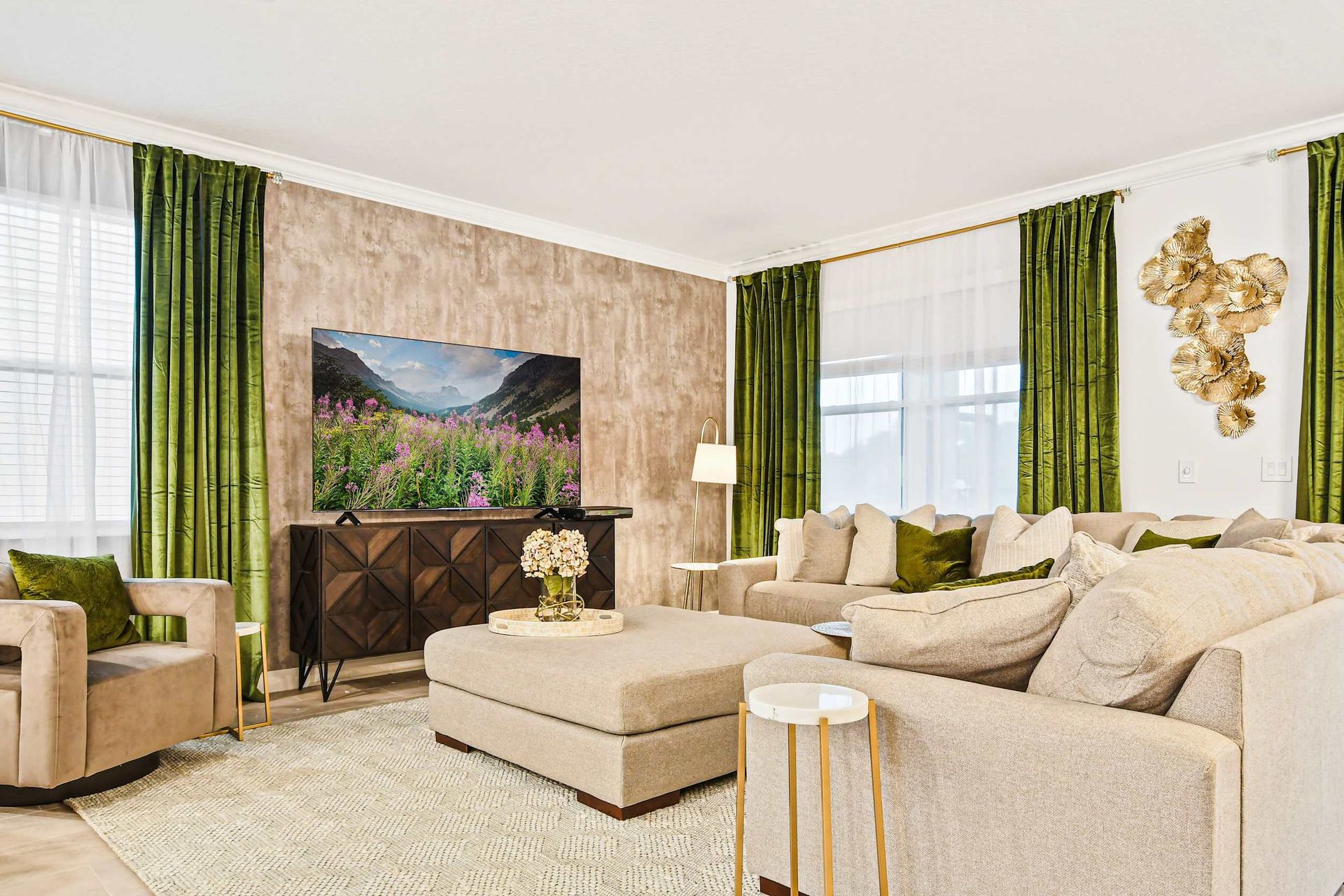 Elegant living room with plush seating, bold green drapes, and modern charm